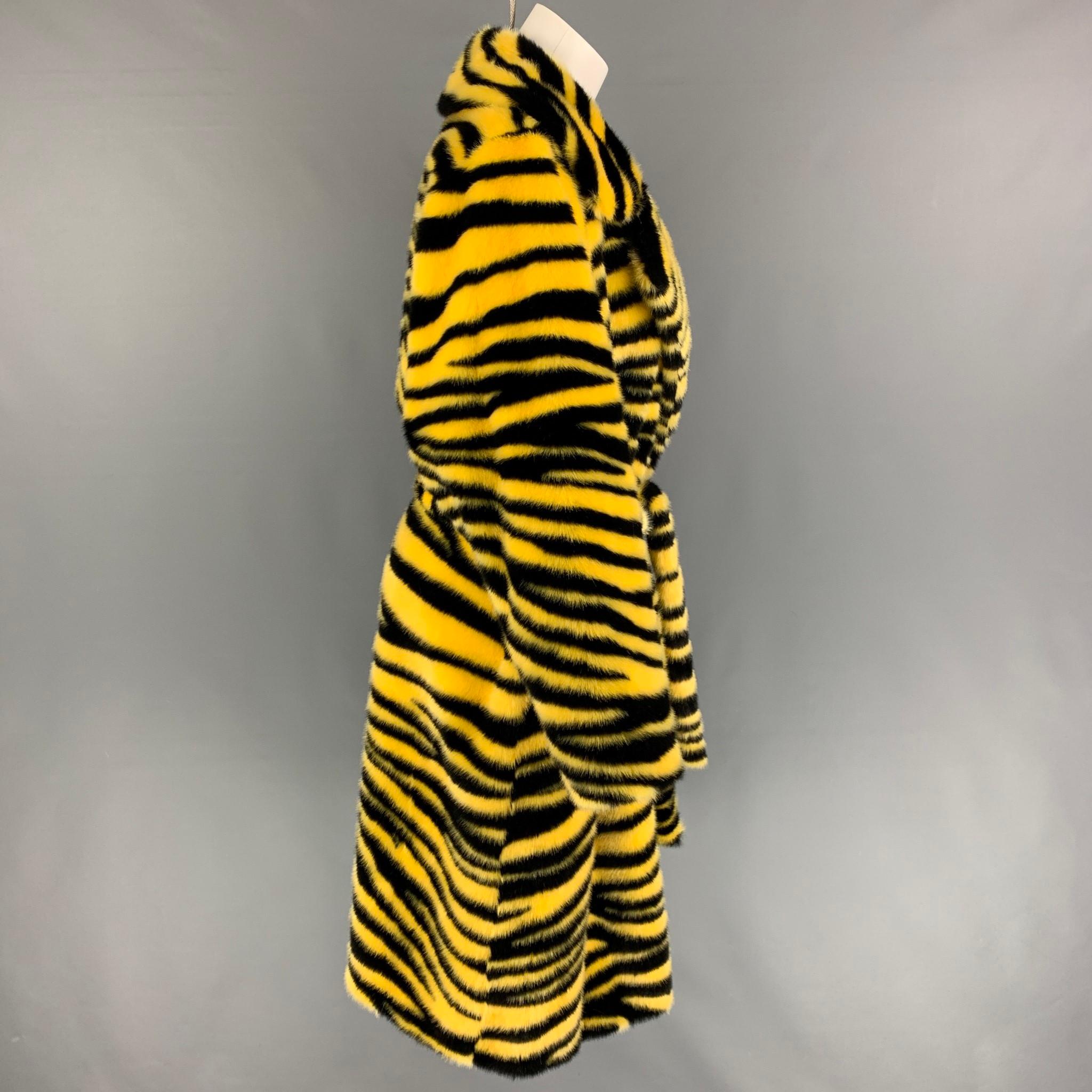 STAND STUDIO AW 20 'Crystal' coat comes in a yellow & black zebra print faux fur featuring a notch lapel, slit pockets, belted, and a double breasted closure. 

New With Tags. 
Marked: 36

Measurements:

Shoulder: 16 in.
Bust: 42 in.
Sleeve: 23