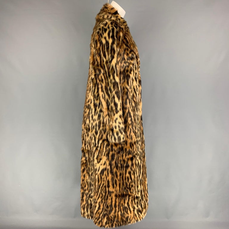 STAND STUDIO coat comes in a tan & black animal print faux fur featuring a notch lapel, slit pockets, ad a hidden snap button closure. 

Very Good Pre-Owned Condition.
Marked: Size tag removed.

Measurements:

Shoulder: 15 in.
Bust: 36 in.
Sleeve:
