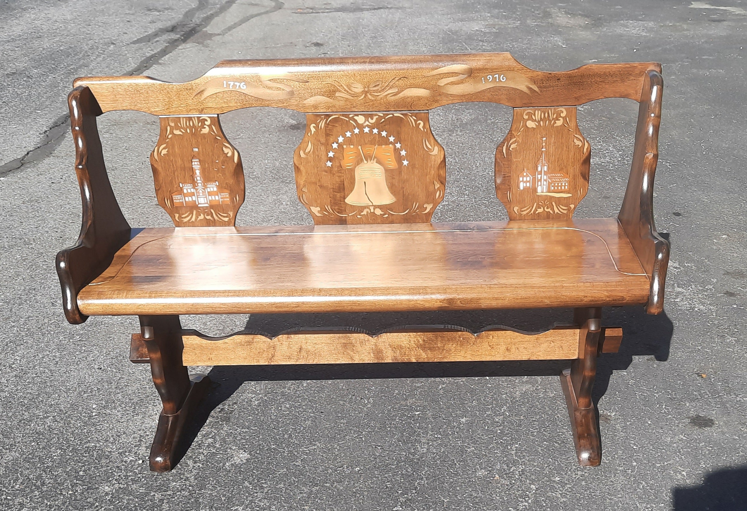This rock solid bench is made by Standard Chair of Gardner Inc. in Massachusetts. What we have found out is a limited edition chair only made in 1976 for the 200 year anniversary of this country. They only made 5000 of these bench which is all