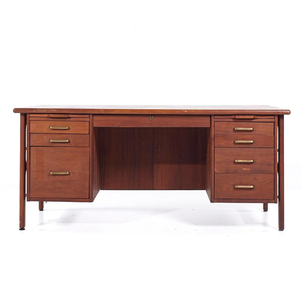 Standard Furniture Mid Century Walnut and Brass Executive Desk

This desk measures: 66 wide x 36 deep x 29 high, with a chair clearance of 24.5 inches

All pieces of furniture can be had in what we call restored vintage condition. That means the