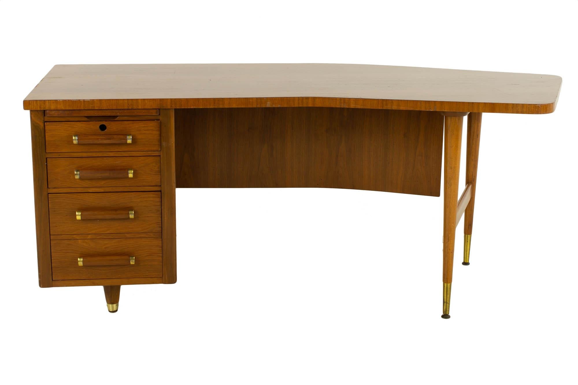 Standard Furniture mid century walnut and cane boomerang desk

This desk measures: 73 wide x 36 deep x 29.25 inches high, with a chair clearance of 28 inches

?All pieces of furniture can be had in what we call restored vintage condition. That