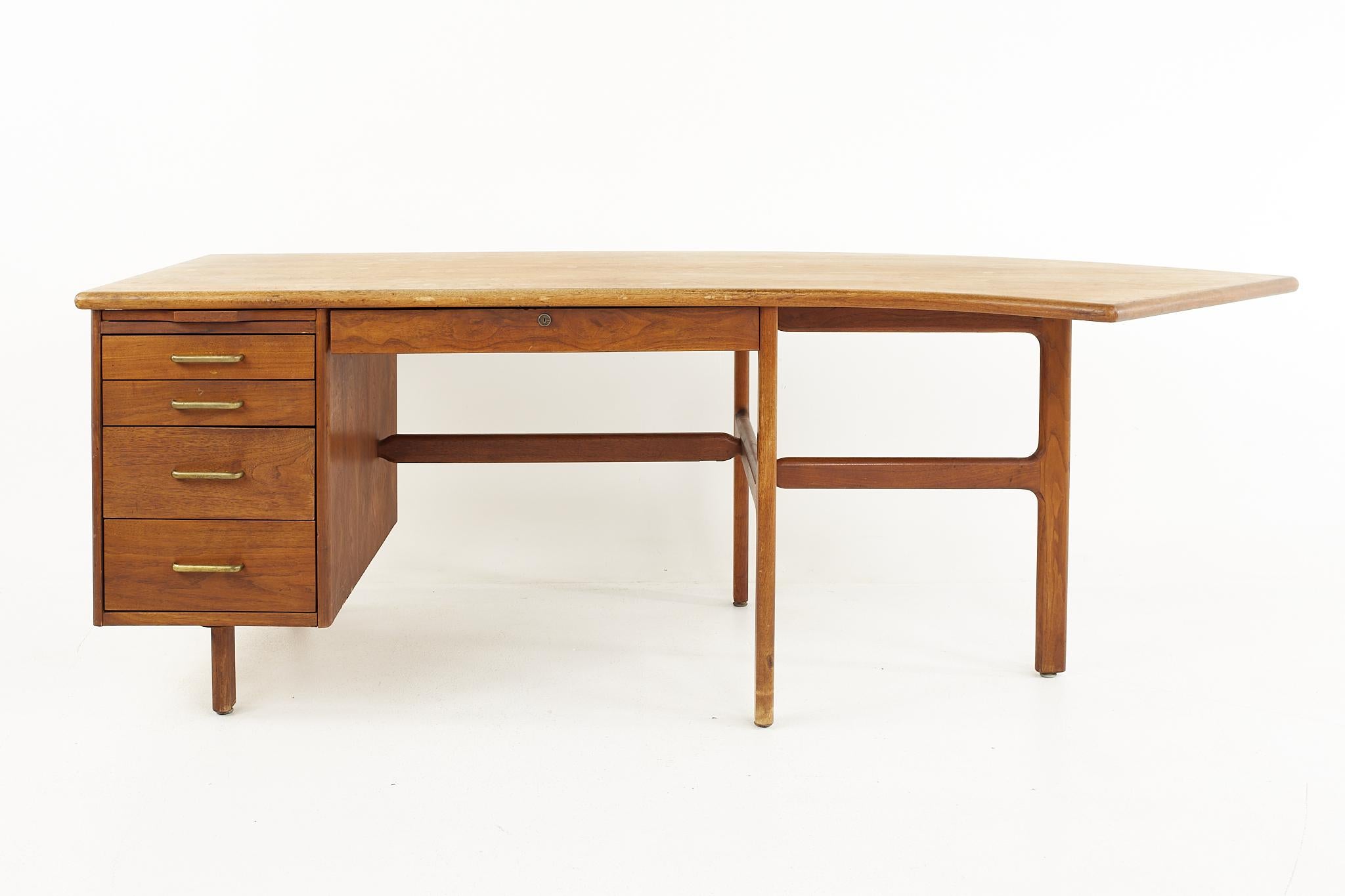 Standard Furniture mid century walnut boomerang desk

The desk measures: 84 wide x 33 deep x 29 high, with a chair clearance of 24.75 inches 

All pieces of furniture can be had in what we call restored vintage condition. That means the piece is