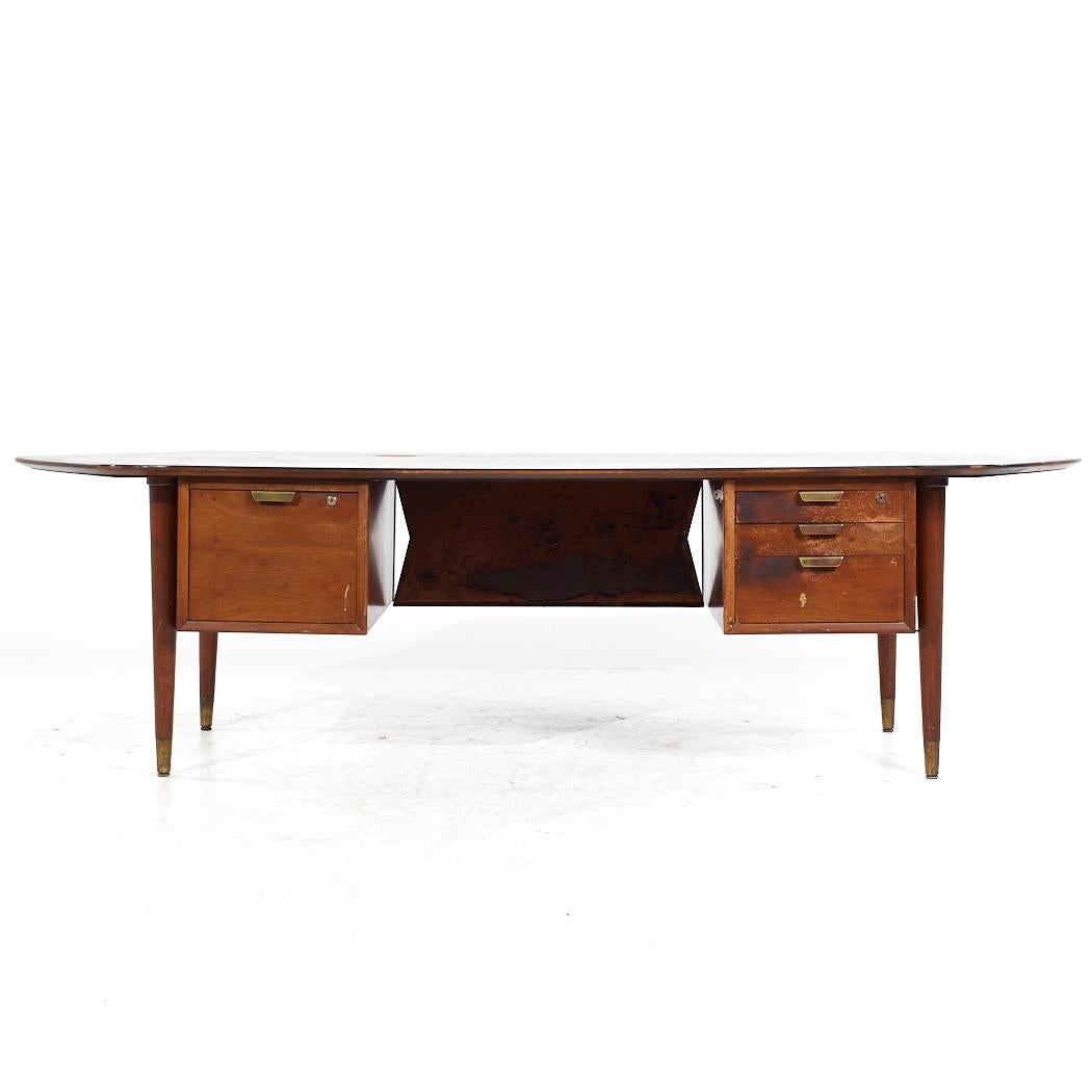 Standard Furniture Mid Century Walnut Boomerang Executive Desk

This desk measures: 103.5 wide x 41.75 deep x 28.75 high, with a chair clearance of 27.5 inches

All pieces of furniture can be had in what we call restored vintage condition. That