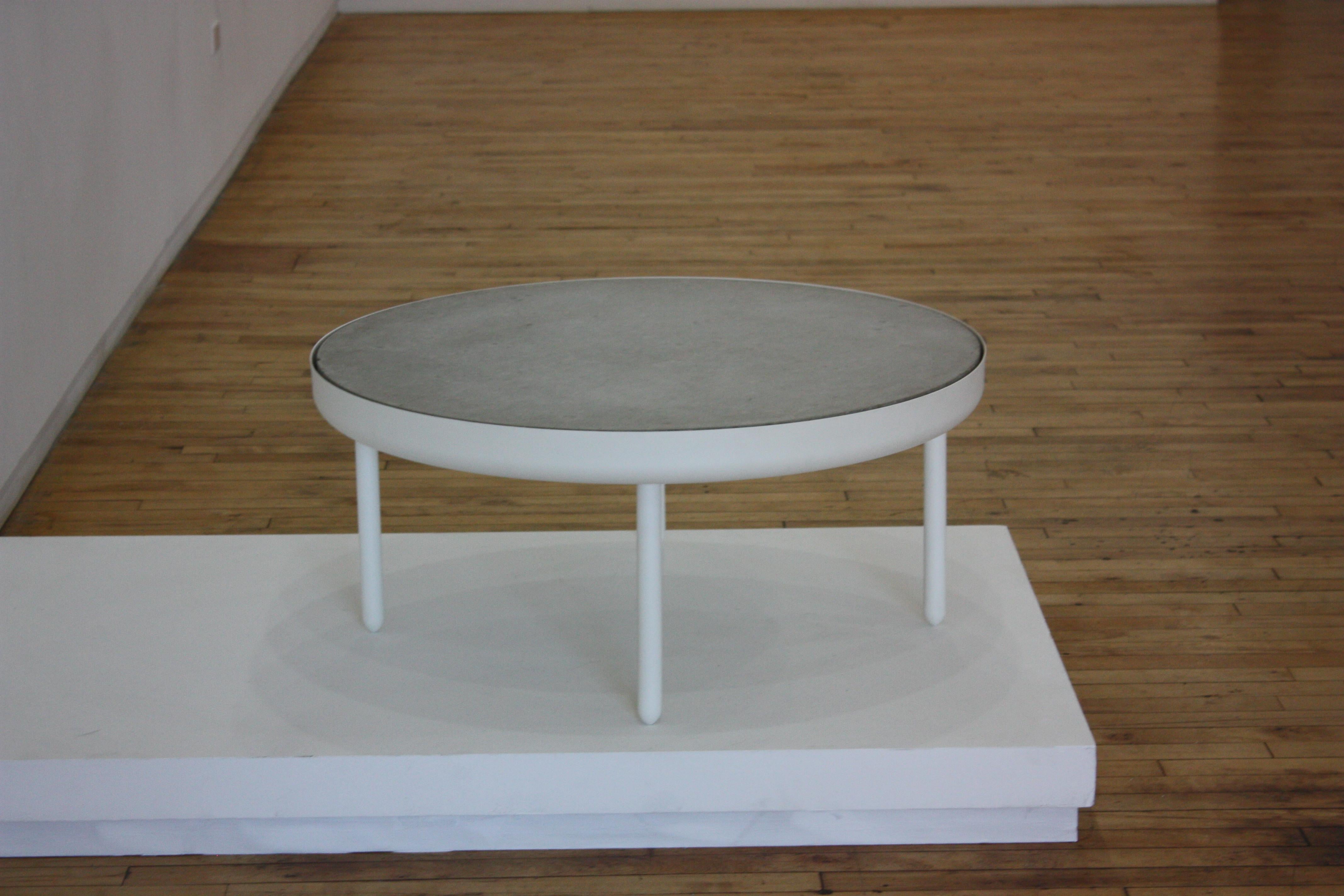 The standard table is made in spun, machined and powder-coated aluminum with an inset cast concrete top. Produced for The New, the inaugural show of Volume Gallery, 2010. Variations and powder colors and tops are available upon request. Limited