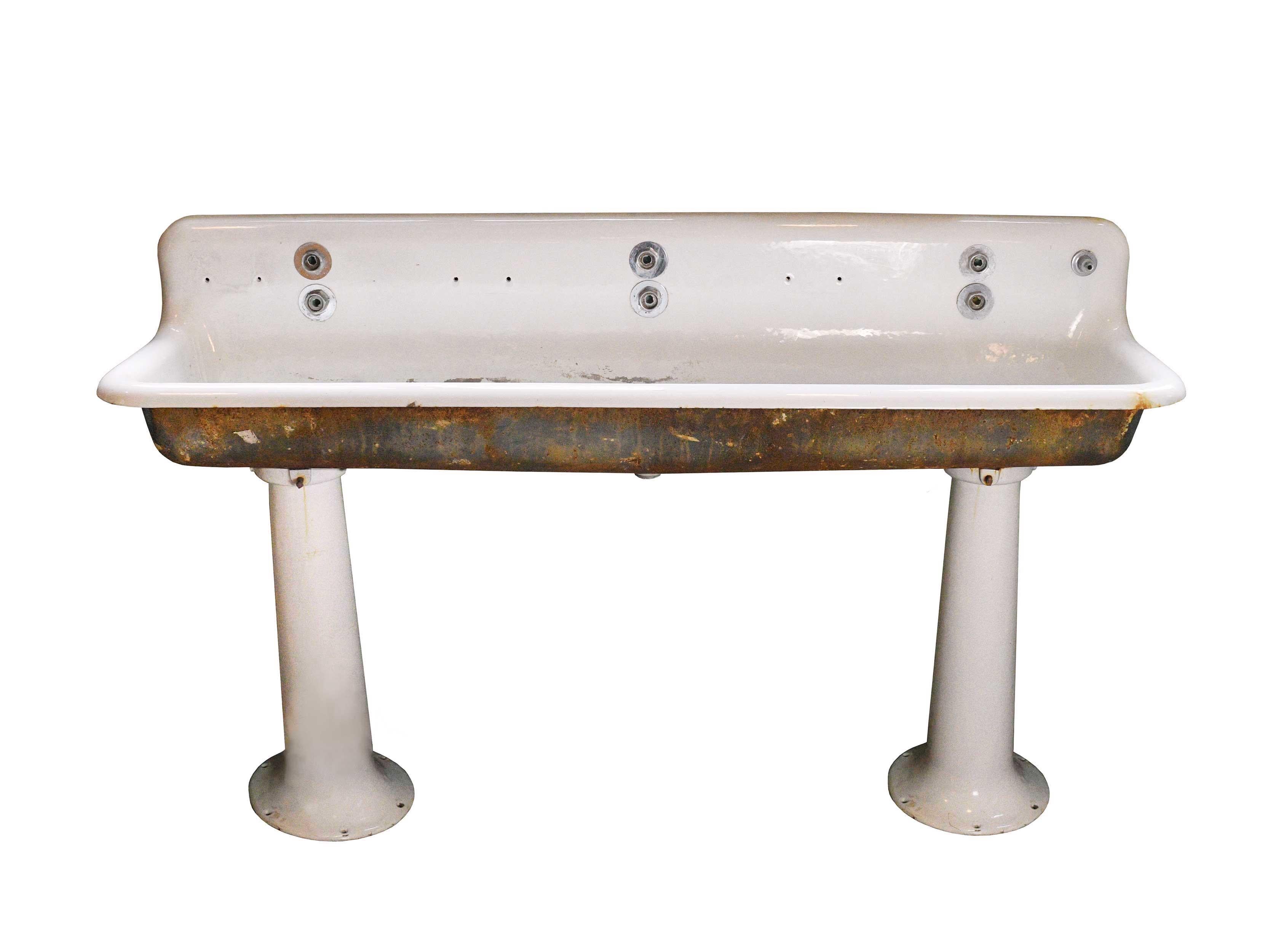 A large, Classic standard six foot porcelain sink with back splash and two legs. Perfect for adding a rustic, farmhouse look to any space. 

circa 1930
Condition: Good
Finish: Original
Country of origin: USA

Overall measurements: 72