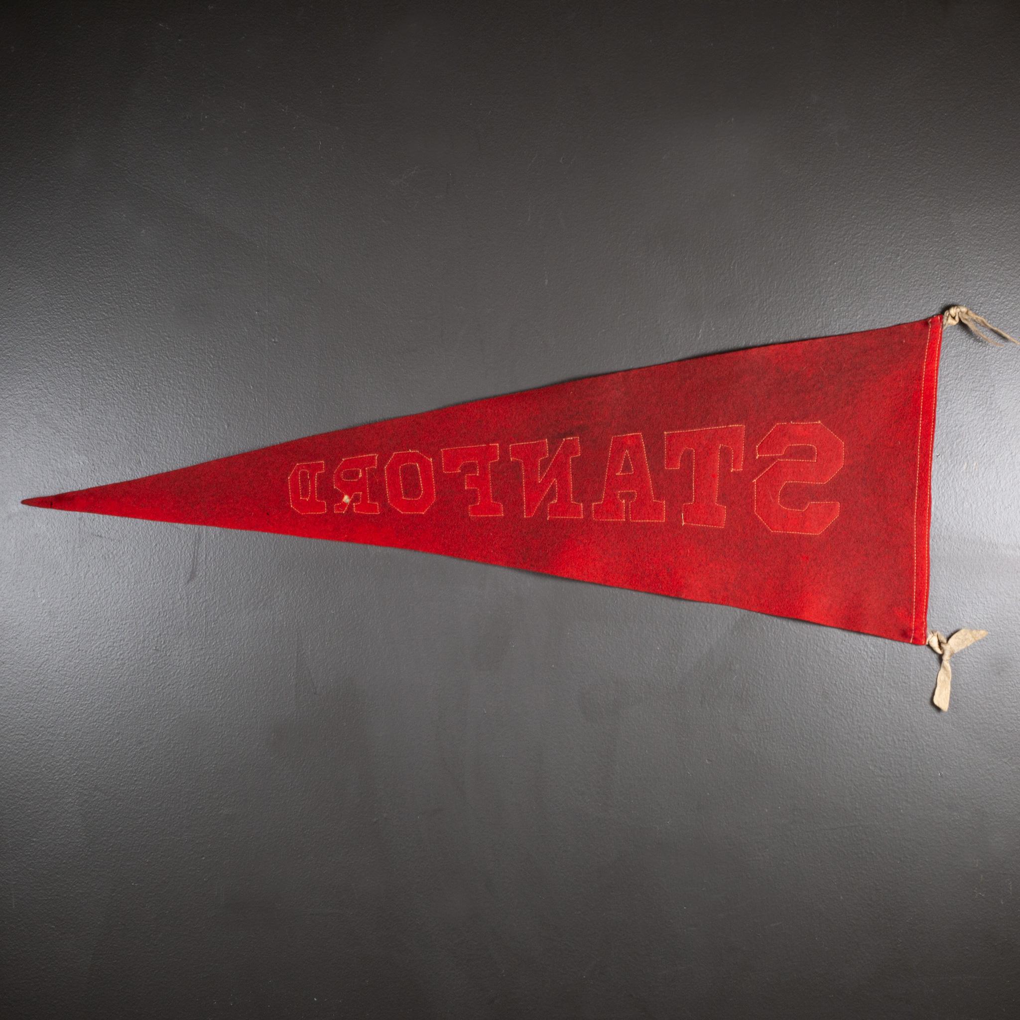 Vintage university pennant banner with sewn letters and tassels.

 CREATOR A & Co. New York, Wright & Ditson Athletic.
 DATE OF MANUFACTURE circa 1920-1940.
 MATERIALS AND TECHNIQUES Felt. 
 CONDITION Good. Wear consistent with age and use.
