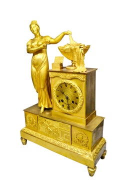 Empire Gilt Bronze  Clock of Standing Classical Lady Unveiling an Urn of Plenty