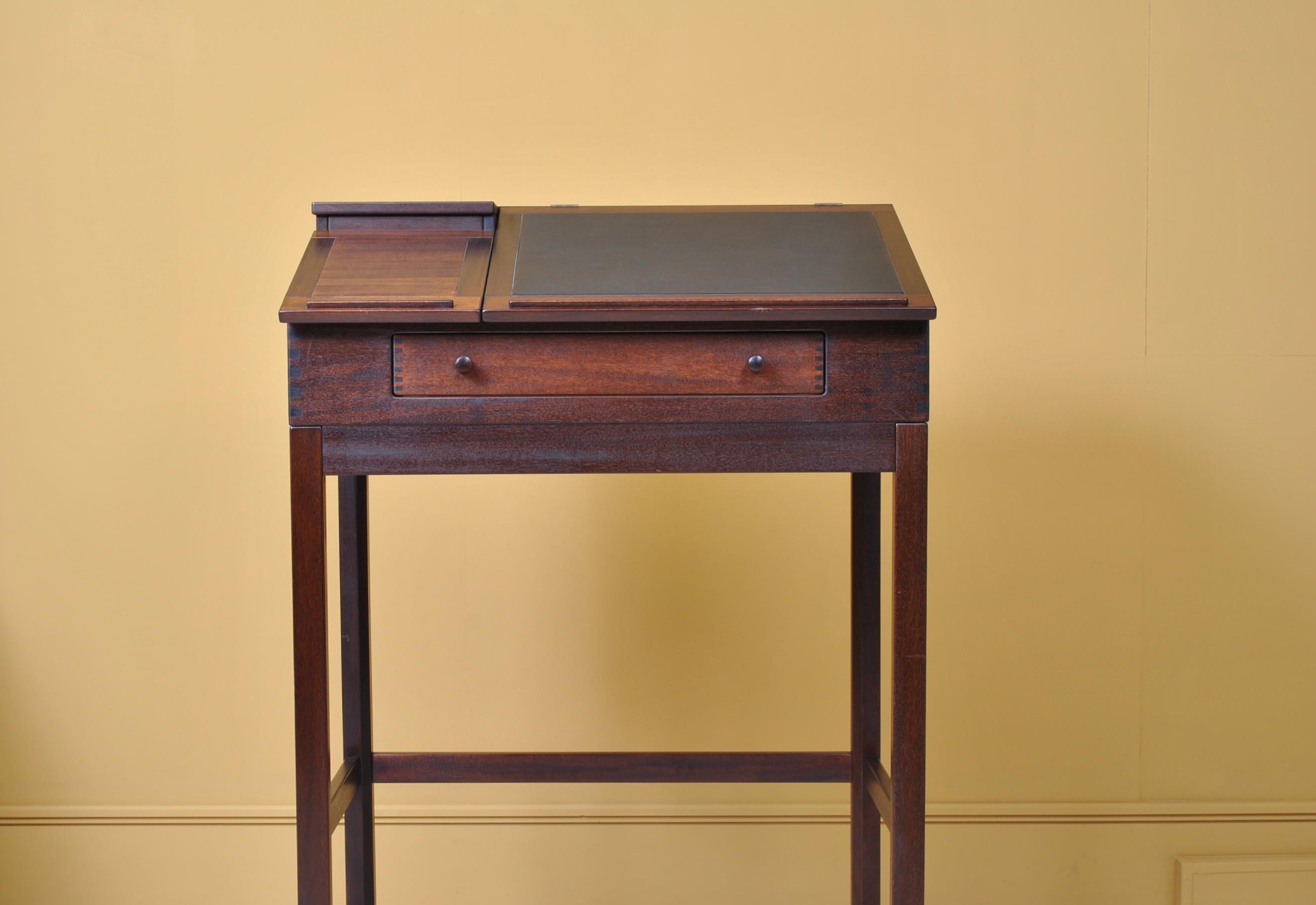 Danish mahogany standing desk by Andreas Hansen for Hadsten, Denmark, 1980s.
Flip top leather inlaid surface with compartmentalised interior with one-drawer below. Scooped pen trays to top.
It is possible to dismantle for easier and cost effective