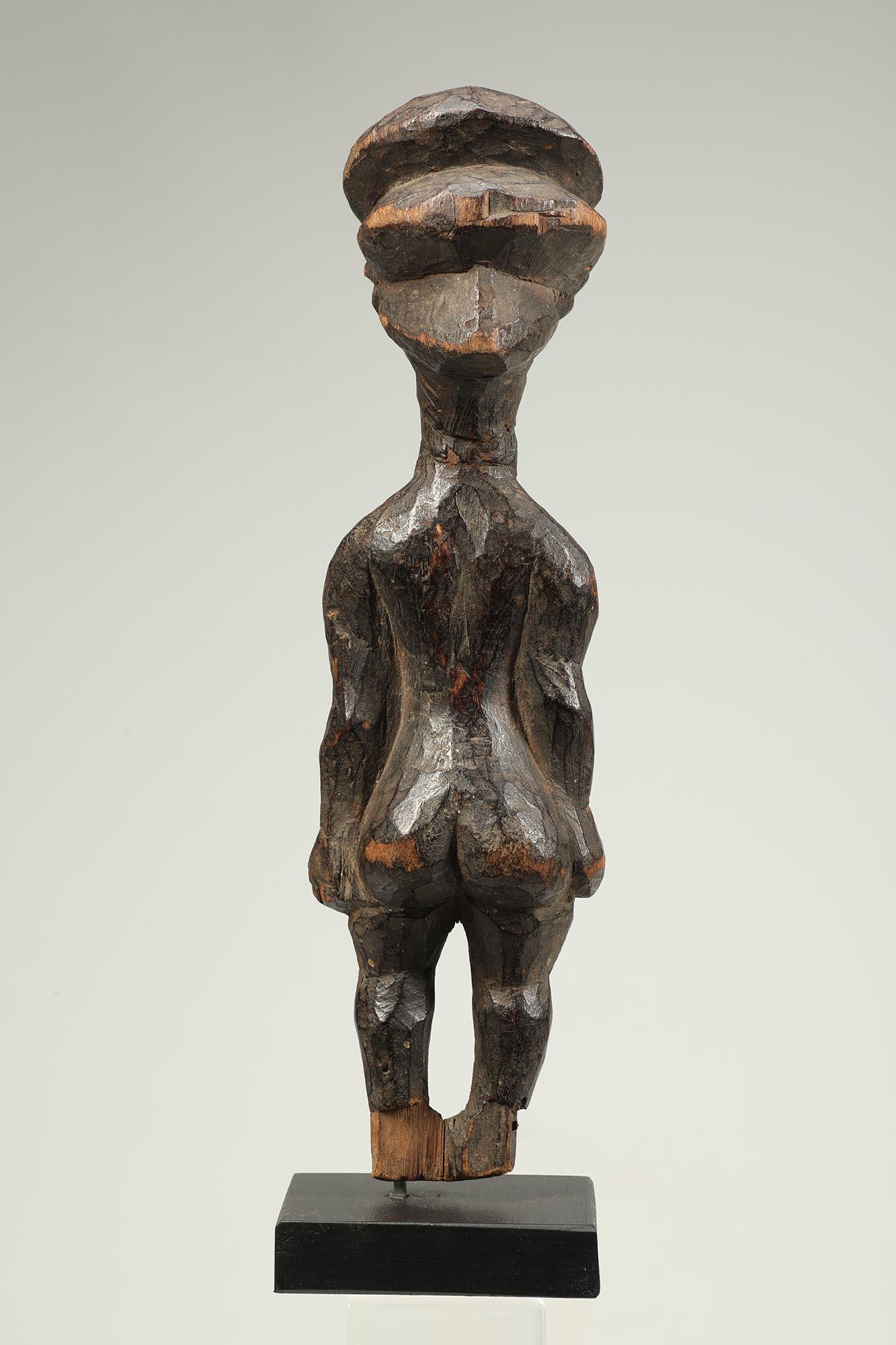 20th Century Standing Female Pende Wood Figure with Arms at Sides Cascading Hair Congo For Sale