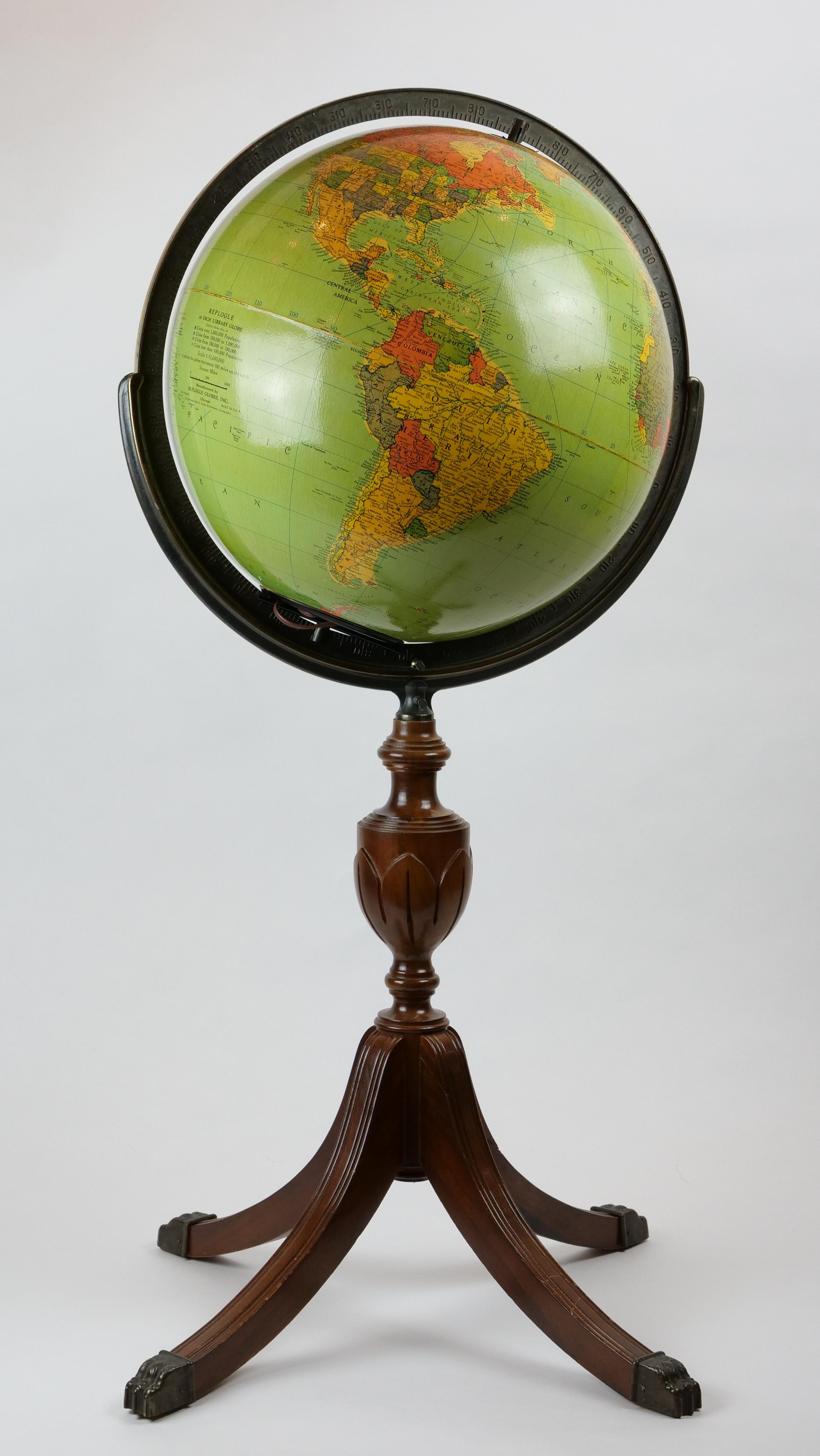 Mid-20th century wood and glass 16 inch standing library globe with interior light by Replongle Globes.