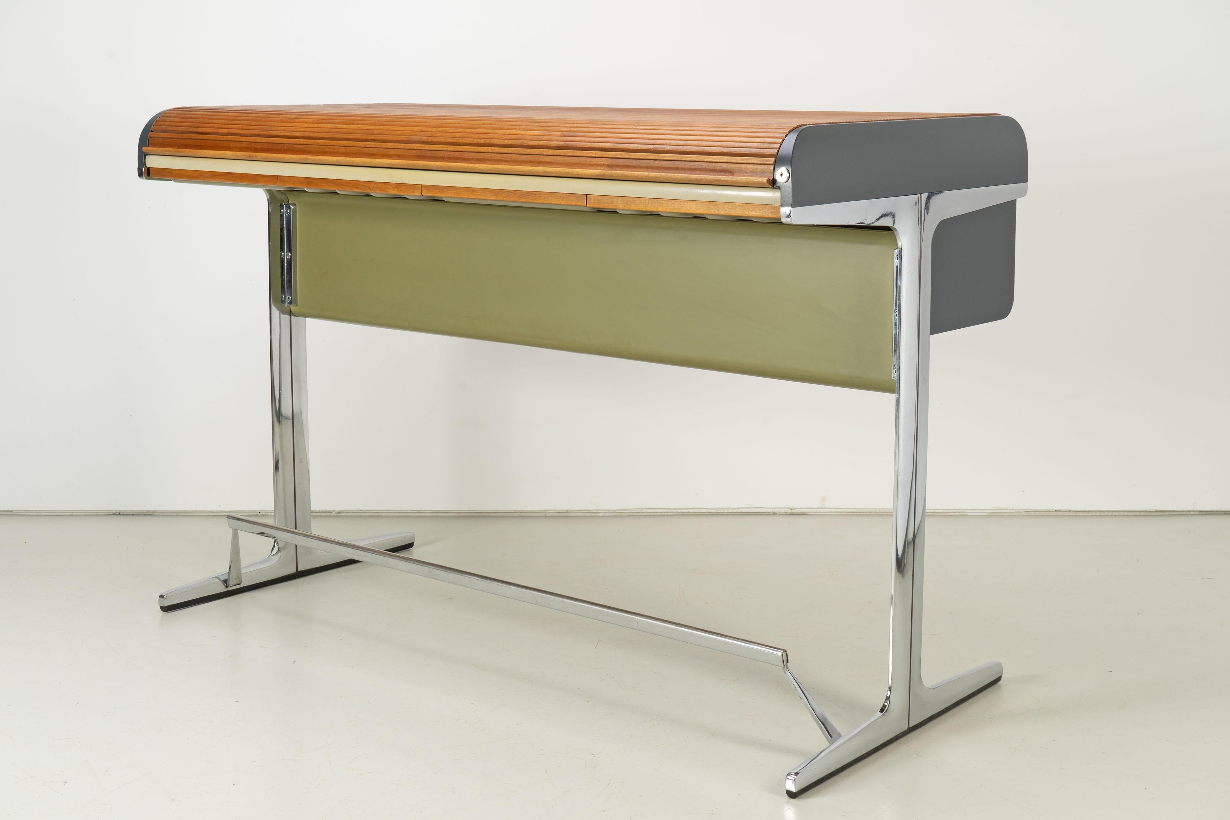 Large standing-height desk with matching chair by Herman Miller. Desk with lockable writing surface and storage compartment, four drawers at the front. The desk comes with optional phone holder for the left side.

 