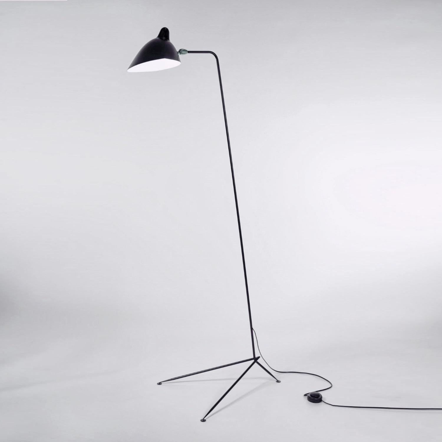 Clean, simple lines describe the elegance of this Serge Mouille floor lamp. A long, slender arm, supported by a tapered triangular base, allows the swiveling shade to illuminate at any angle. With brass accents. 
Available in black or white.