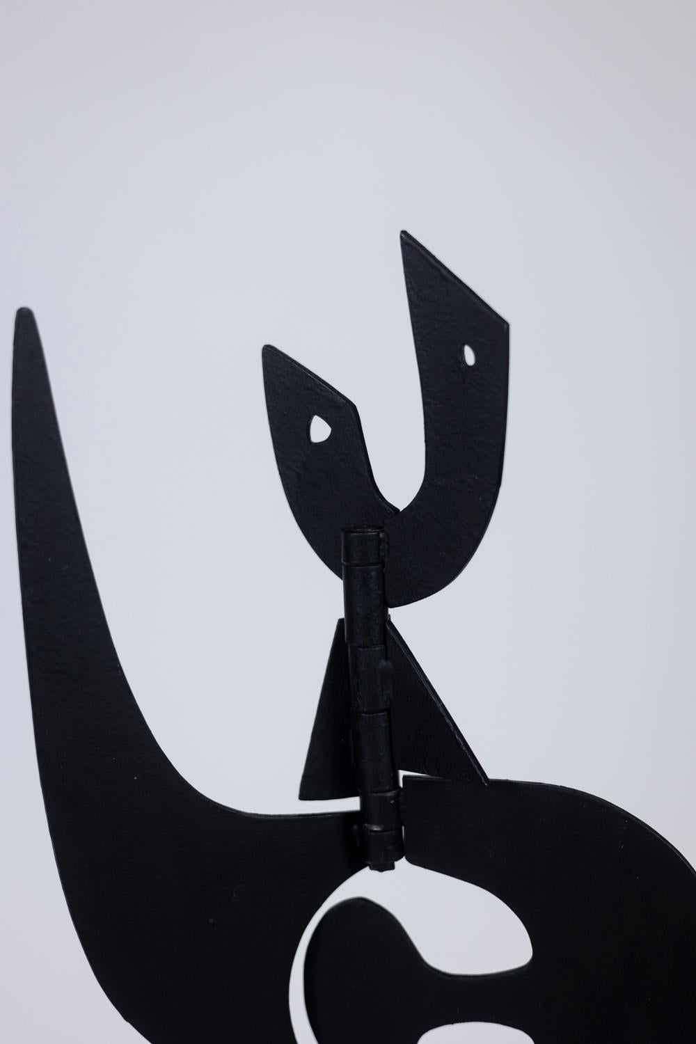 Standing sculpture entitled “Jouve”, in black lacquered metal, the different parts tilting and allowing to obtain different shapes.

Work of contemporary artist.