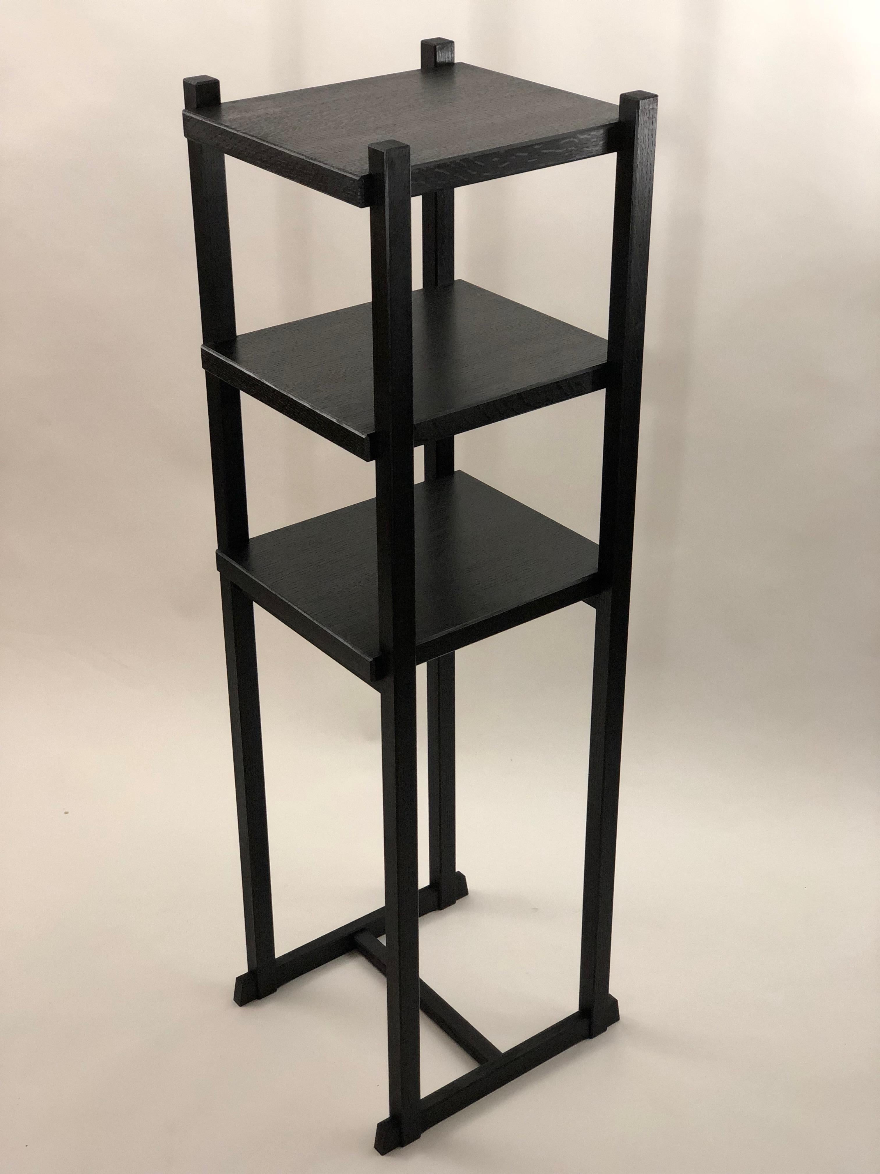 These standing shelves are created utilizing traditional interlocking joinery to form a lightweight, strong and durable structure. Offsets are planned into each joint to allow for careful chamfering of every part, making for a soft hand that