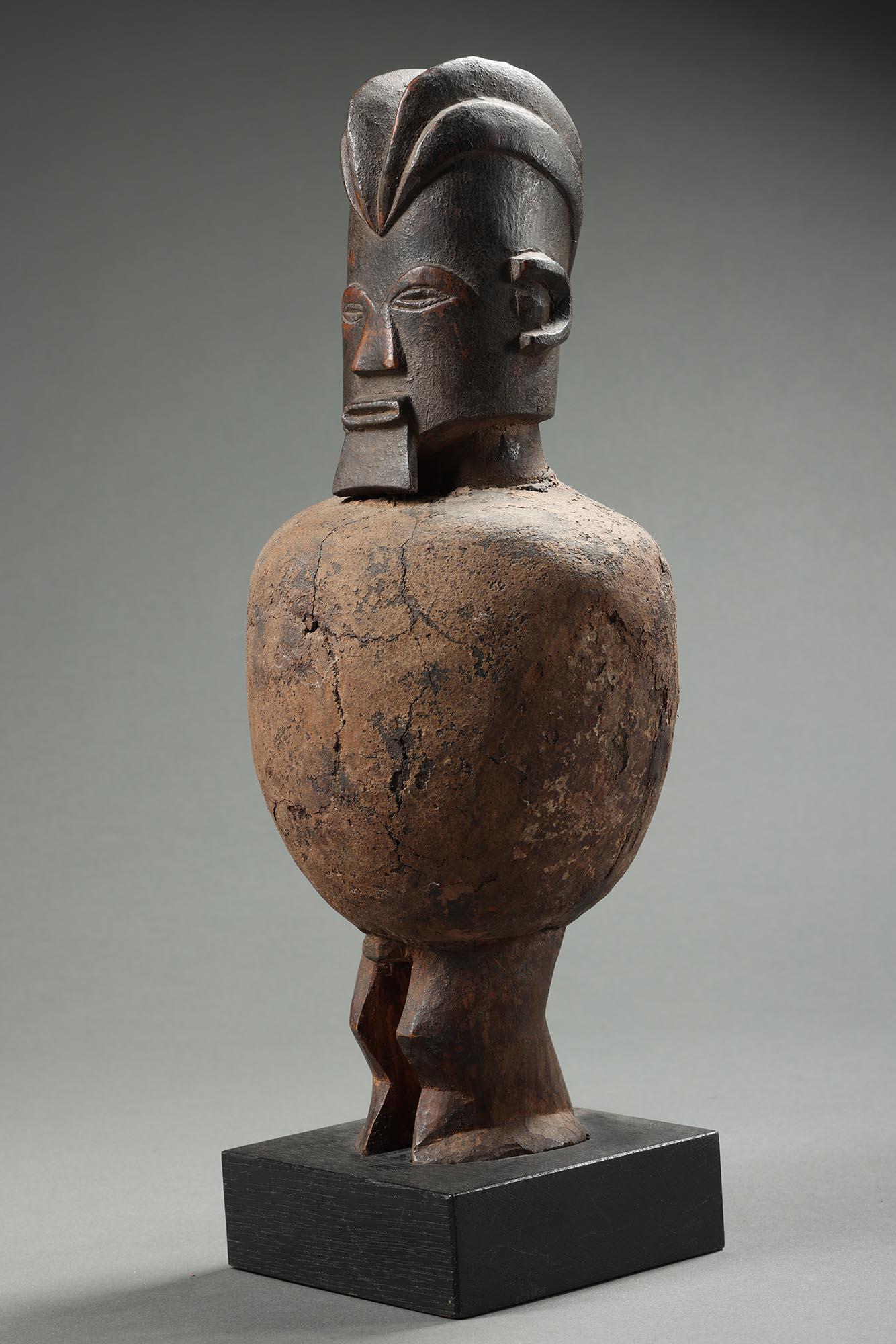 Large important standing Teke fetish figure with original hard clay fetish bundle. from DRC Congo, Africa. Finely carved expressive face with classic projecting beard.

Provenance: ex- private collection California, originally purchased from James