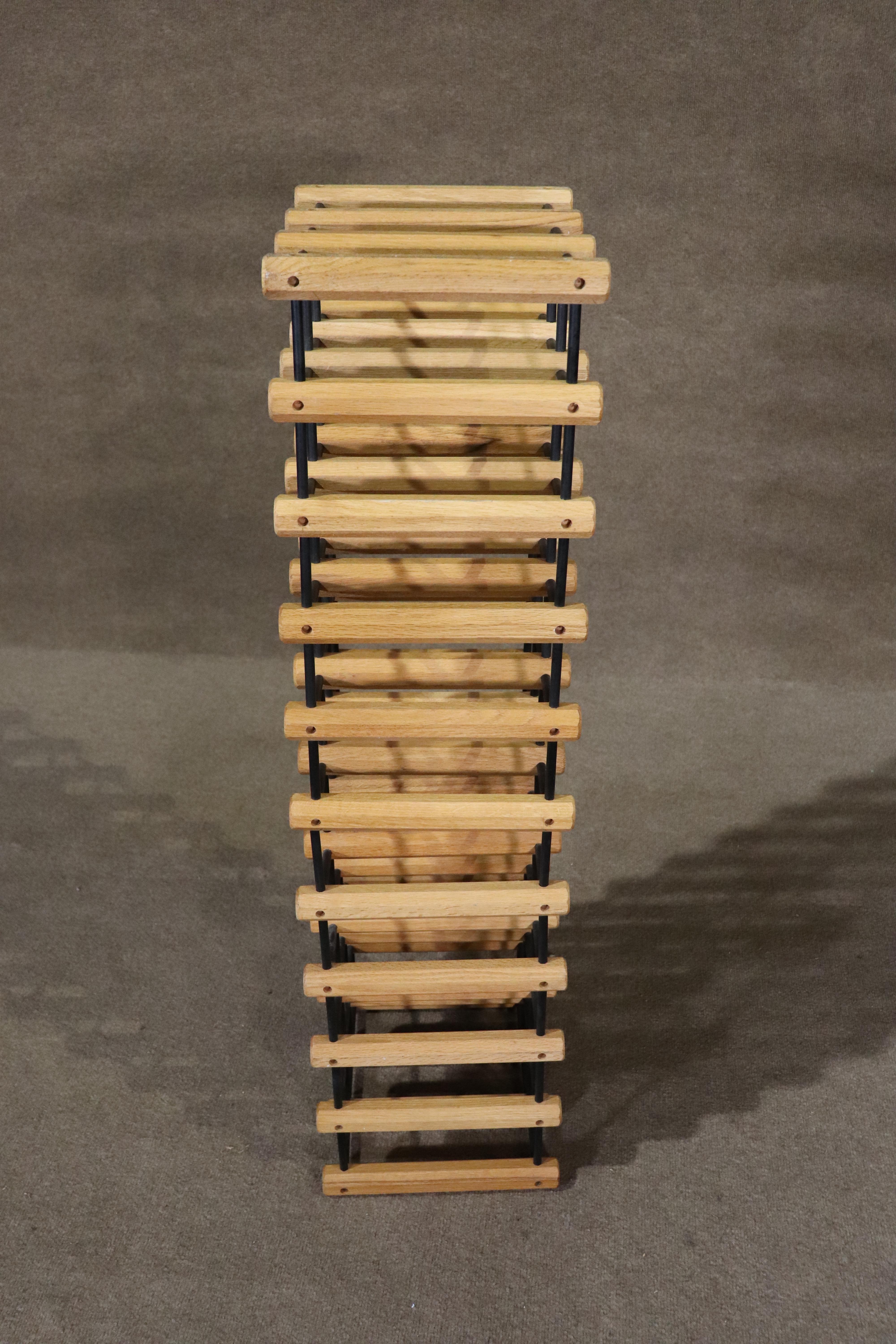 Solid wood pegs with connecting black dowels make up this 3.5 foot tall rack. Holding up to 30 bottles, vertically or horizontally.
Please confirm location NY or NJ