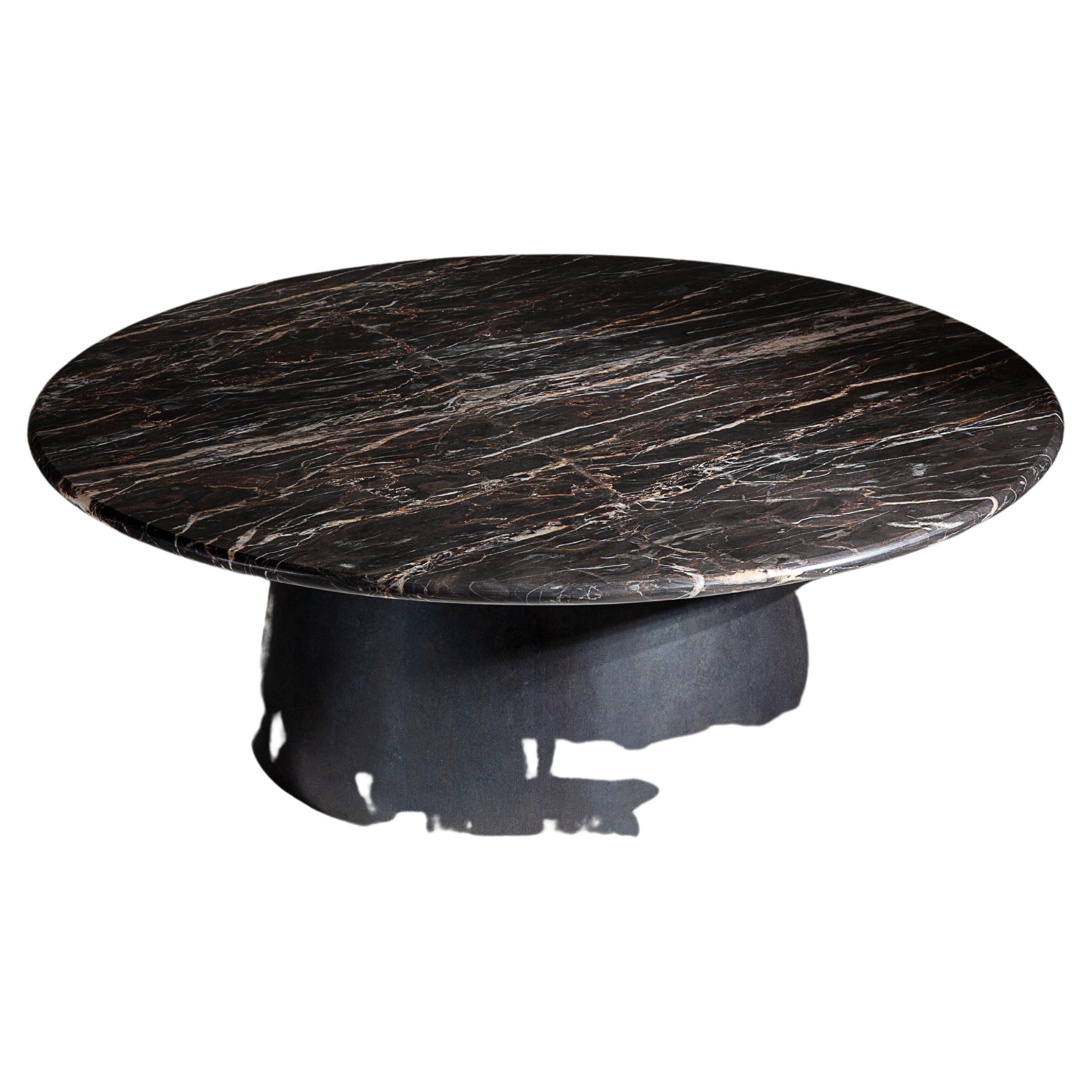 A circular coffee table in incredibly rare British marble and blackened steel. Hand crafted to order in the North.

Measures: 80cm diameter x 35cm height.
Custom finishes and sizes available upon request.

Made to order in 12 weeks.
Price excludes