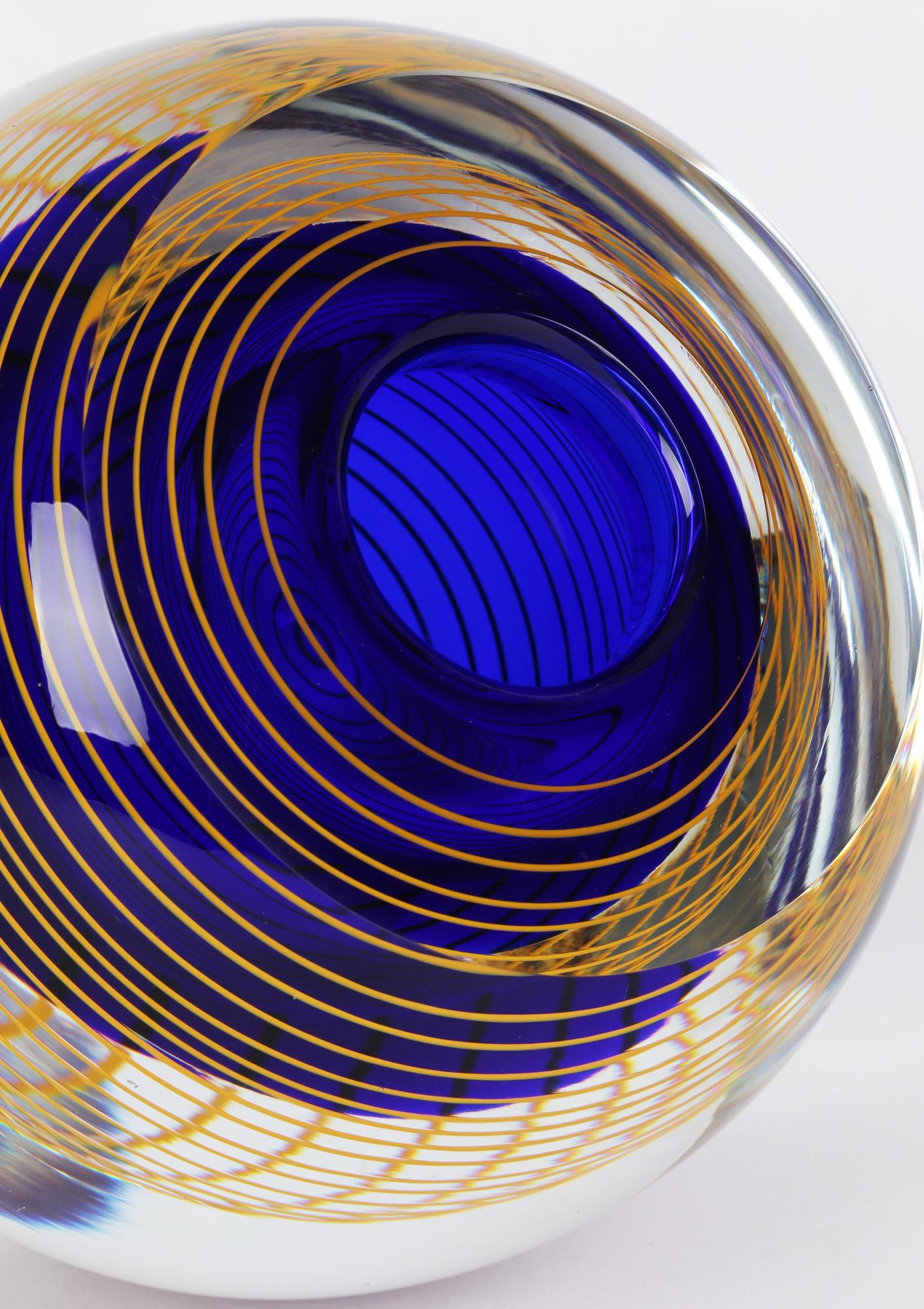 A stunning Czech art glass vase with a spiral twist design by Stanislav Libensky (1921-2002) for Beranek Skrdlovice Glassworks and dating from around 1977. This heavily hand made vase is of rounded bulbous shape with a narrow flat polished base and