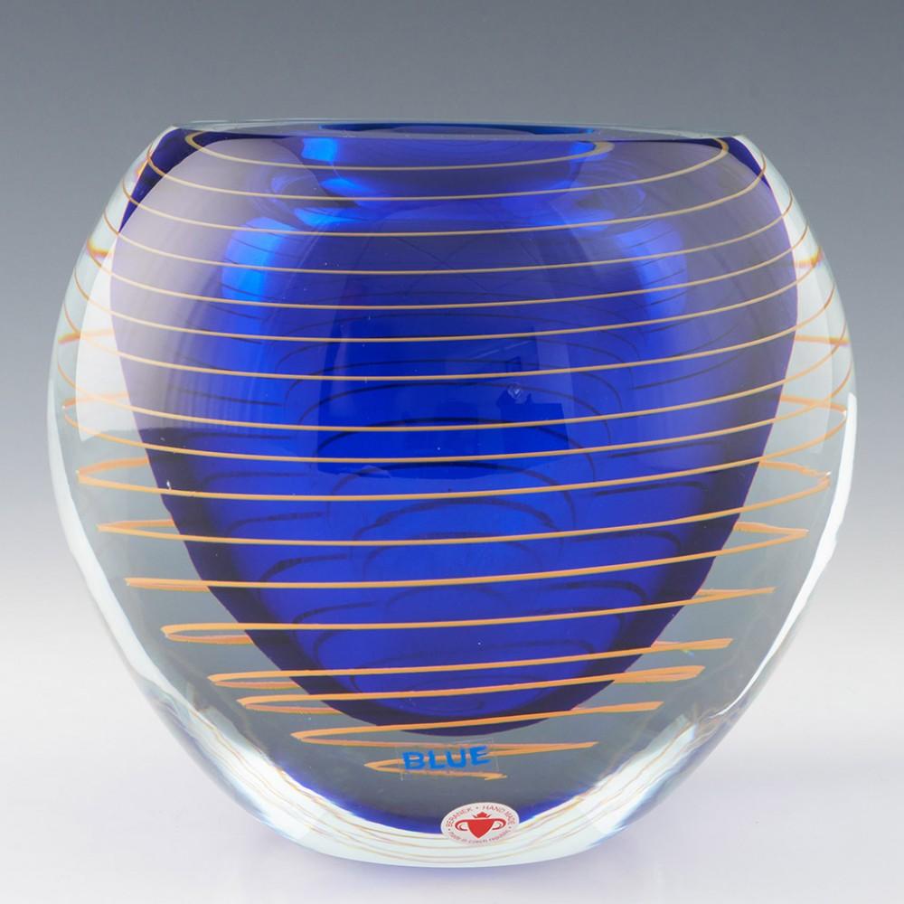 Heading : Stanislav Libensky vase
Date : c1975
Origin : Czechoslovakia
Bowl Features : Clear glass with orange spiral around an ink-blue core
Marks : Signed 'Designed by Libensky' - original label
Type : Lead
Size : 16.5cm height, 17.8cm