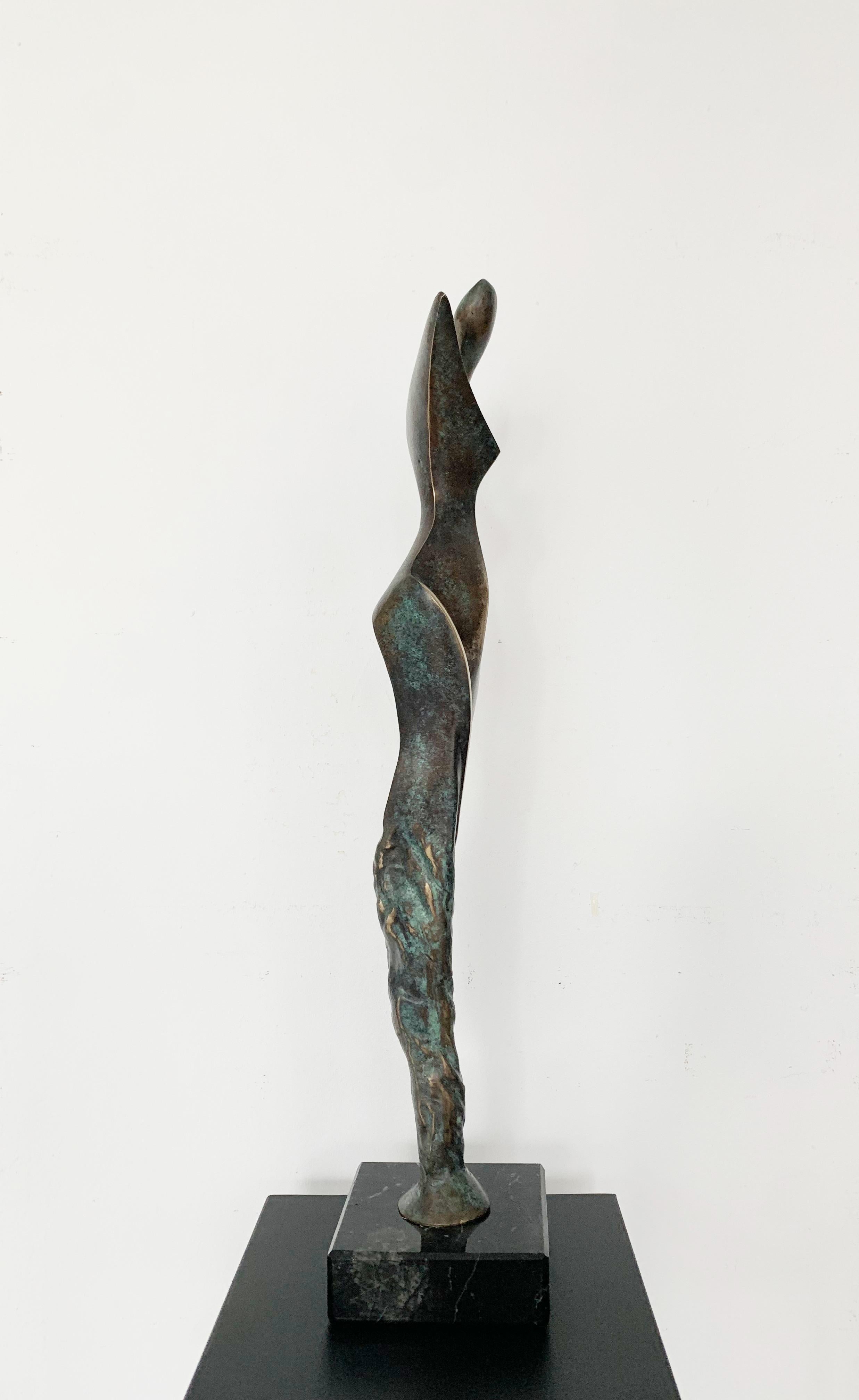 Contemporary bronze sculpture on marble base by Polish artist Stan Wysocki. Artwork comes from limited edition of 8. Sculpture depicts female figure filtered through geometric, synthesizing style. Artist uses patina very consciously as an artistic