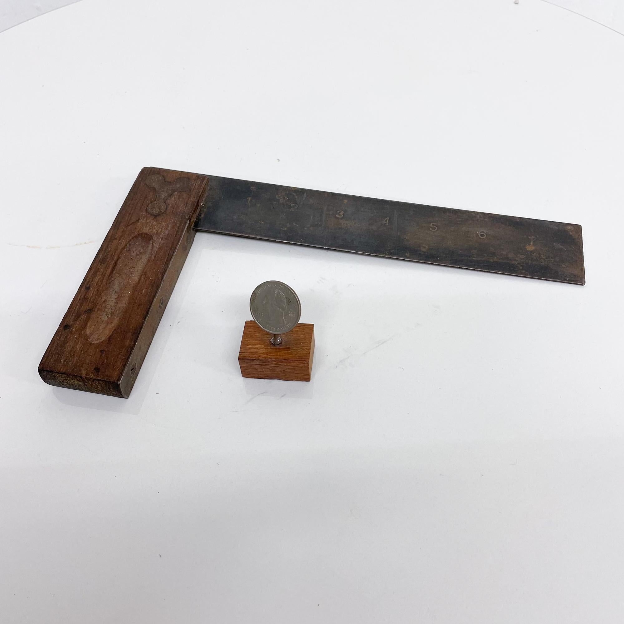 For consideration: Antique tool square ruler carpentry measuring by Stanley.
Metal with brass and rosewood handle. Made in the USA.
Size: 9.5 W x 5.63 Tall x .63 Thick
Original antique vintage presentation and condition. See our images.

 