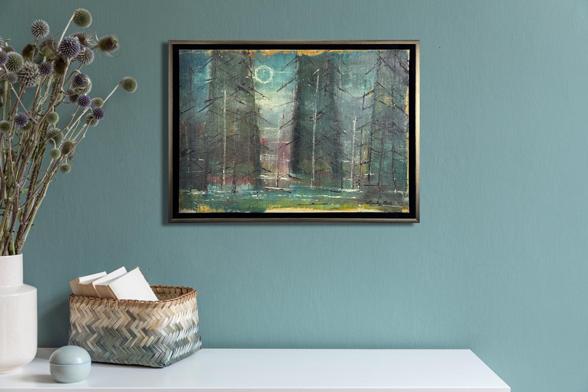 This modern abstract landscape painting by Stanley Bate features a cool, muted palette, with abstracted forms of trees, a deep blue backdrop and a light white circle toward the top of the composition denoting the moon. The piece is framed in a