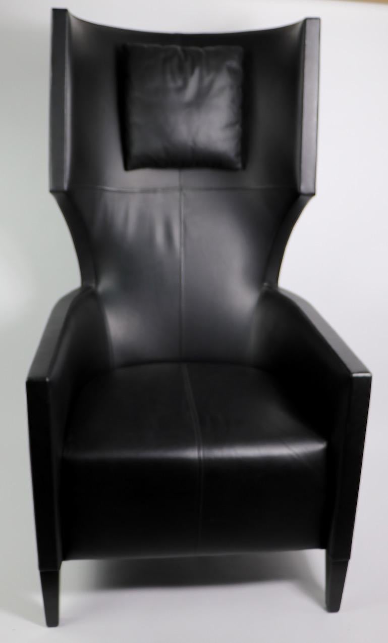 Very bold and forward design, overscale leather lounge chair designed by Stanley Friedman for Brueton. This example is in original black leather upholstery with attached headrest cushion, clean and ready to use. 
Measures: Arm H 24 inch x seat H