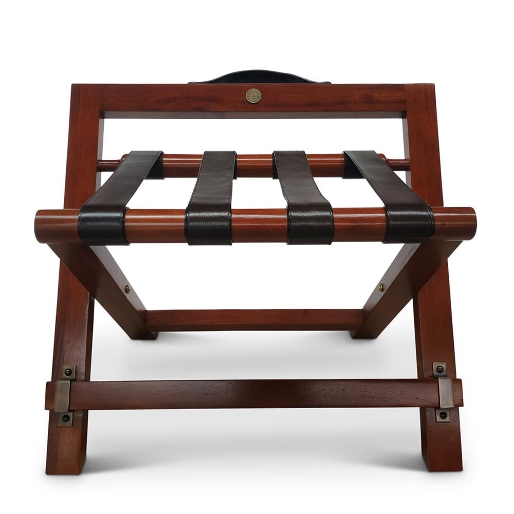 Luggage Rack Stanley with solid wood structure in
varnished honey brown finish. With leather style straps.
Folding luggage rack.