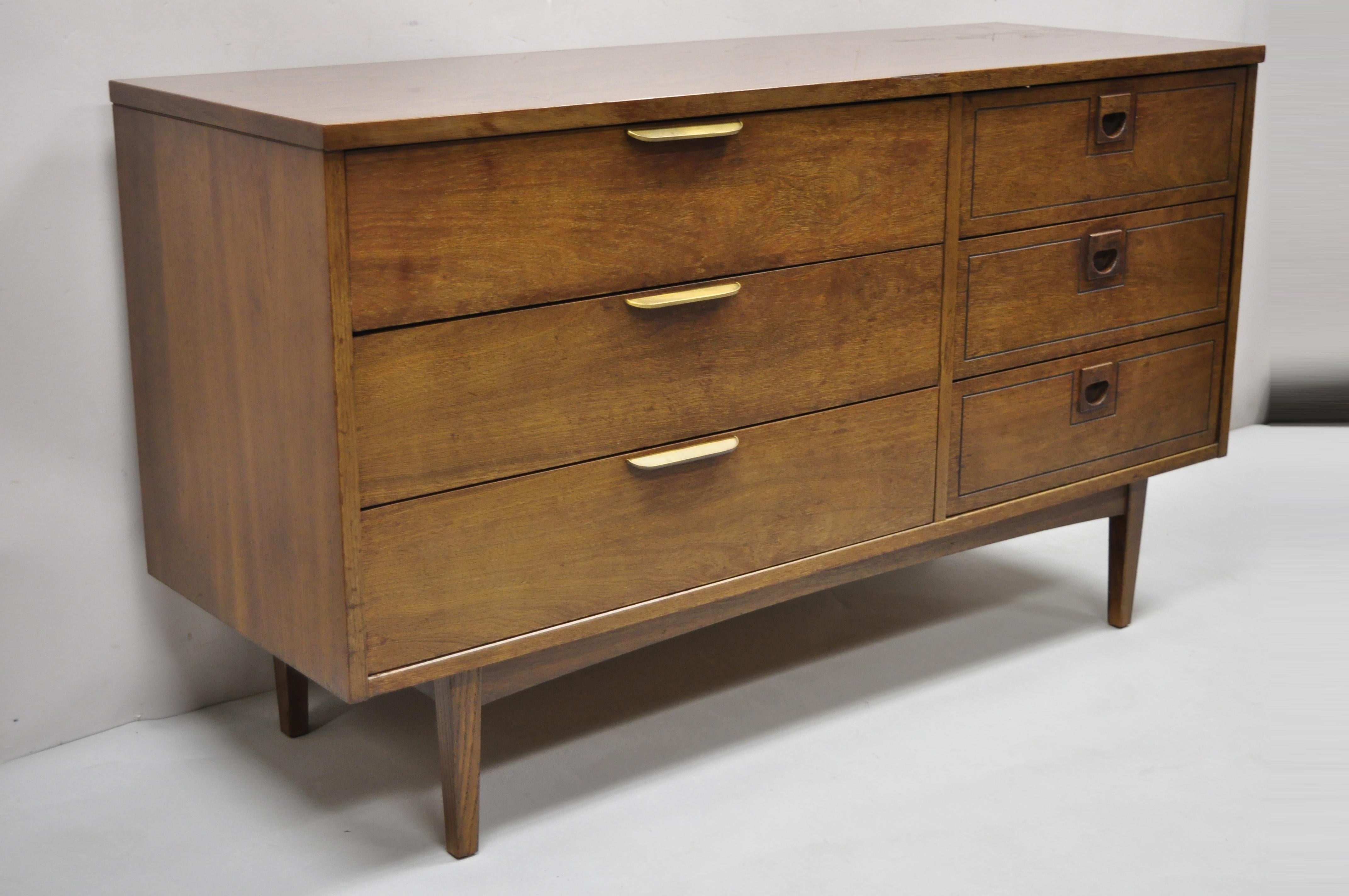 Stanley Mid-Century Modern walnut and Formica top six drawer credenza dresser. Item features wood grain formica top, brass drawer pulls as well as sculpted wood drawer pulls, 6 dovetailed drawers, very nice vintage item, clean modernist lines,