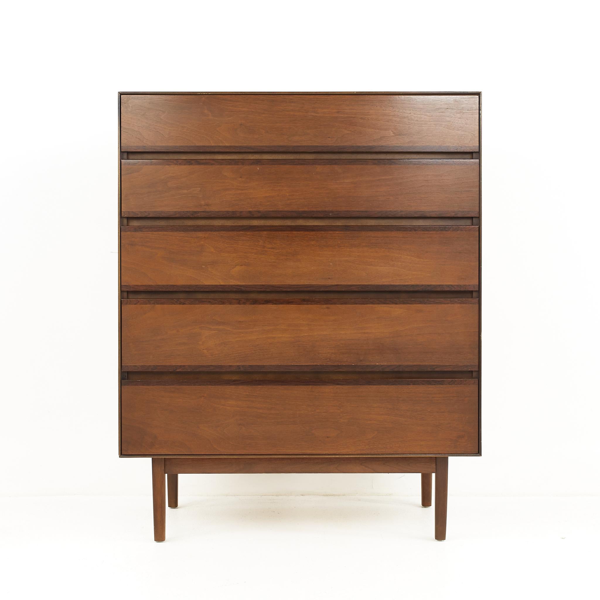 Stanley mid-century walnut 5 drawer highboy dresser.

The dresser measures: 36 wide x 18 deep x 45.25 inches high.

All pieces of furniture can be had in what we call restored vintage condition. That means the piece is restored upon purchase so