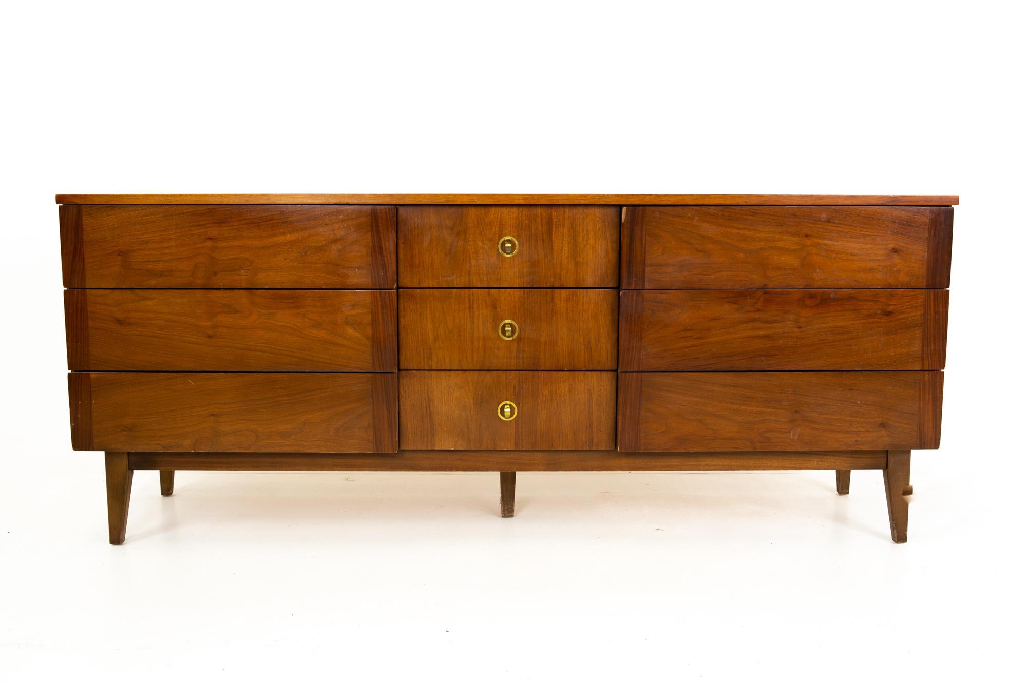 Stanley mid century walnut and brass 9 drawer lowboy dresser

Dresser measures: 72 wide x 18 deep x 30 inches high

All pieces of furniture can be had in what we call restored vintage condition. That means the piece is restored upon purchase so