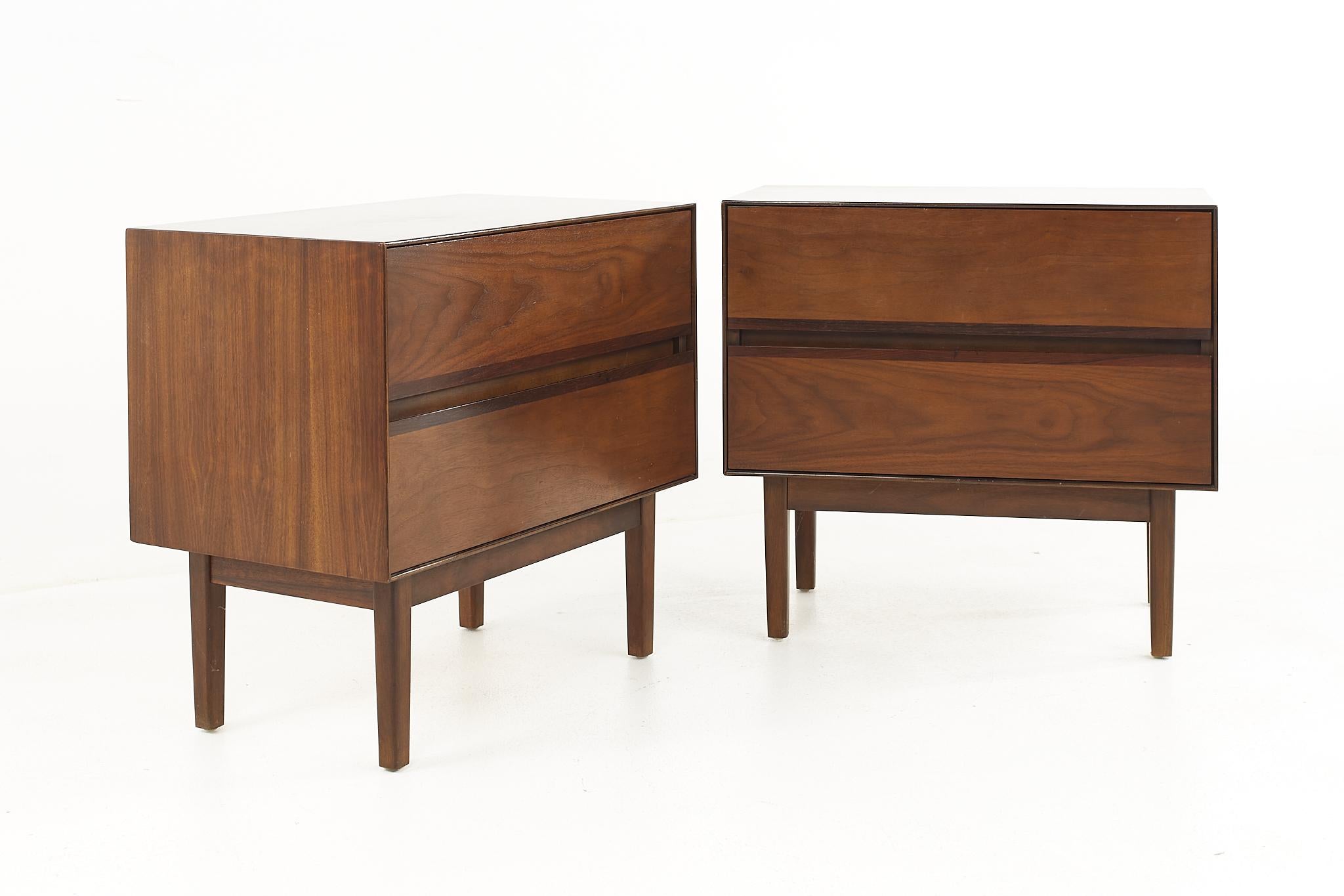 Stanley mid century walnut nightstands, a pair.

Each nightstand measures: 25 wide x 15 deep x 23.25 inches high.

All pieces of furniture can be had in what we call restored vintage condition. That means the piece is restored upon purchase so