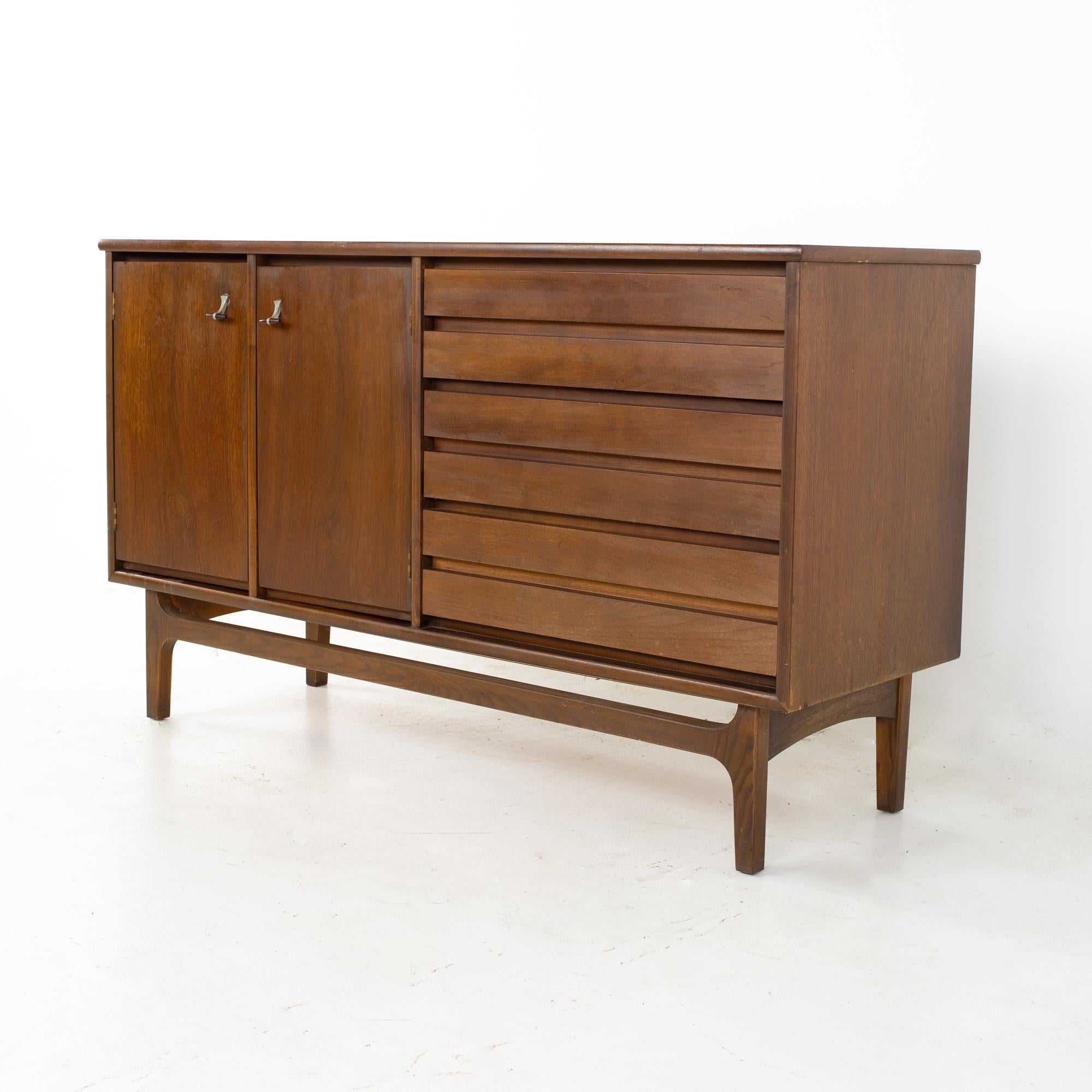 Stanley mid century walnut sideboard buffet credenza
Credenza measures: 54 wide x 18 deep x 32 inches high

All pieces of furniture can be had in what we call restored vintage condition. That means the piece is restored upon purchase so it’s free