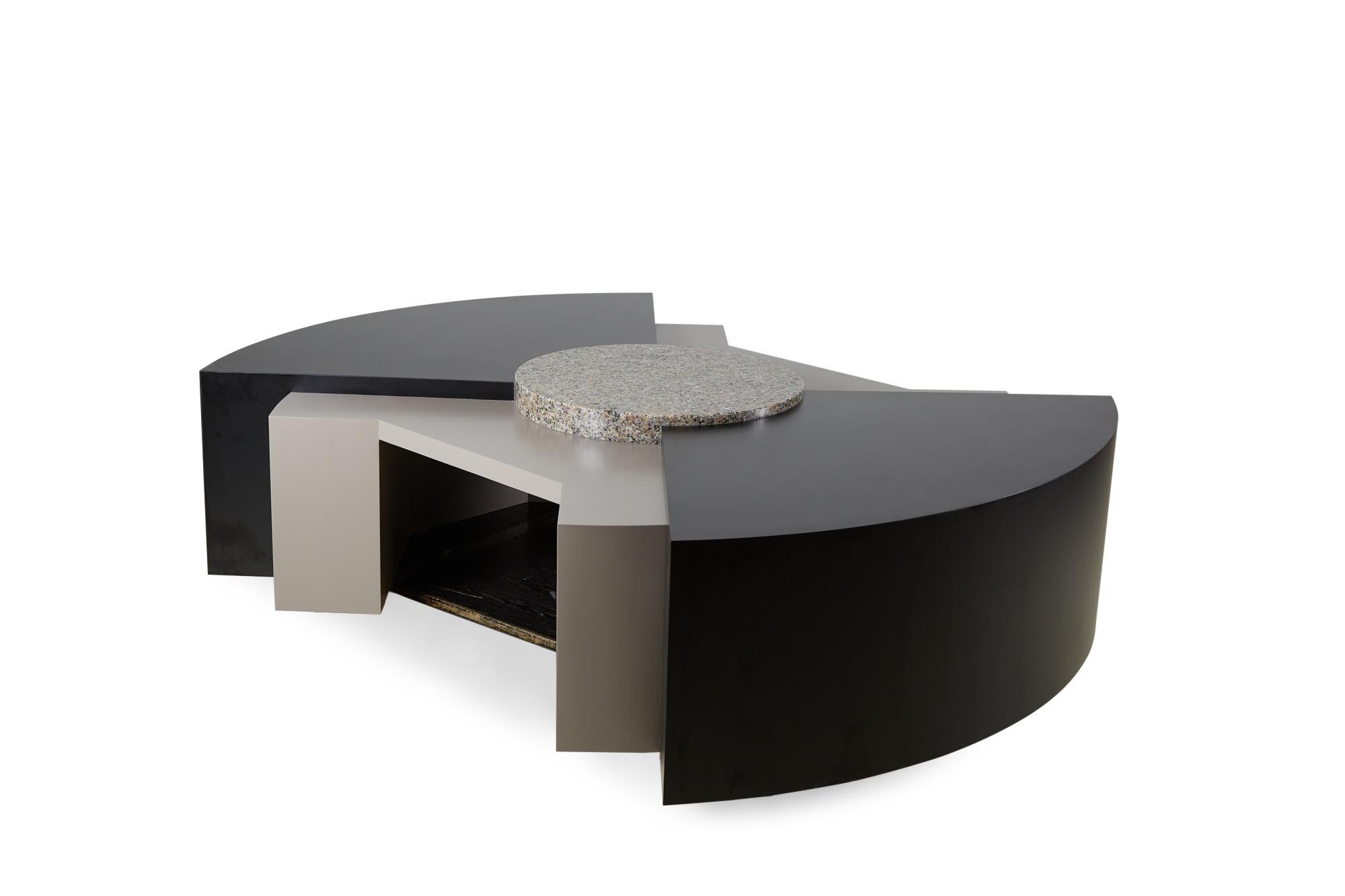 American Post-Modern (circa 1980s) custom coffee / cocktail table with a tiered architectural structure in black and gray mica laminate with a central granite disk. (STANLEY TIGERMAN AND MARGARET MCCURRY)