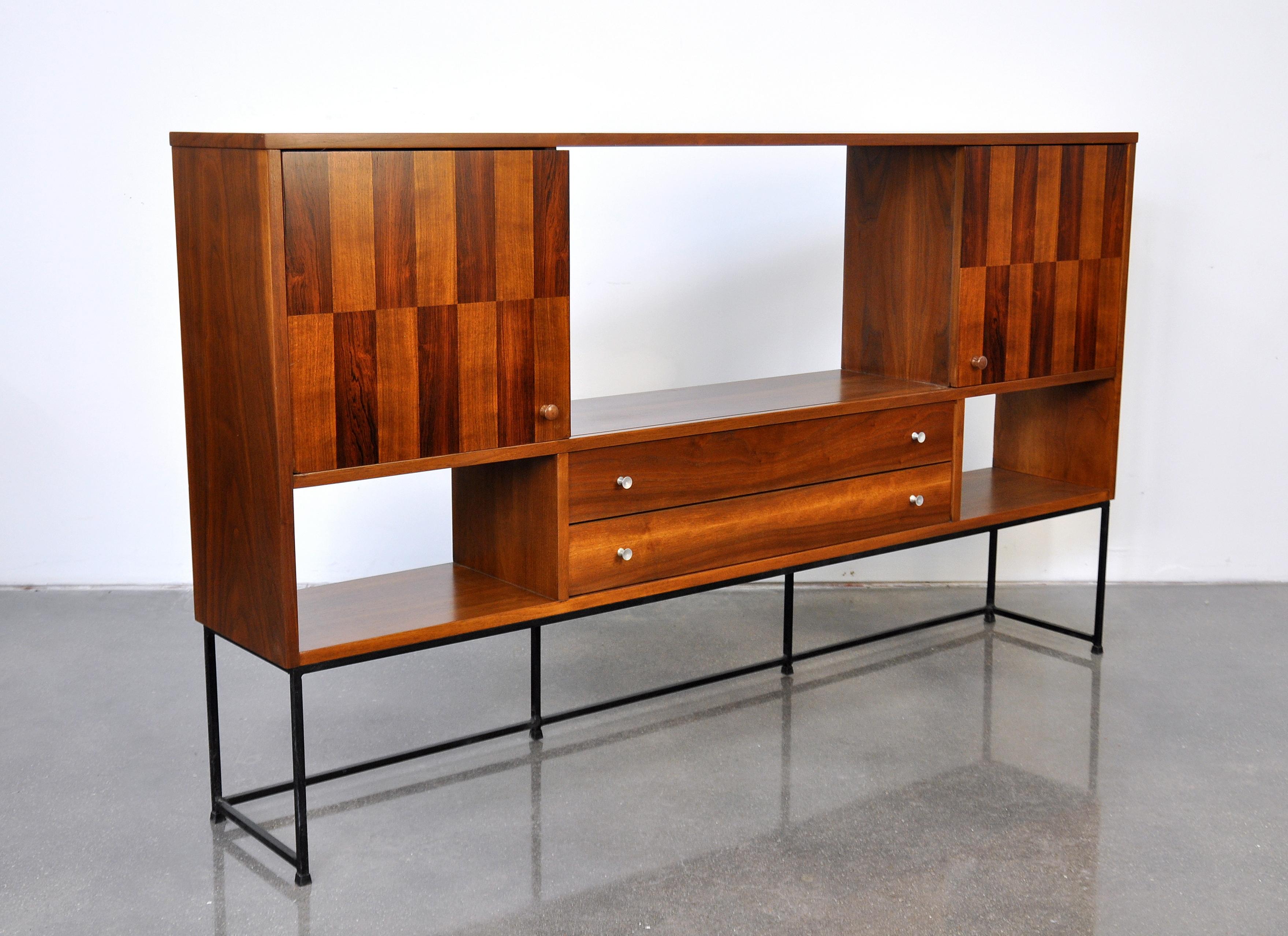 Striking Mid-Century Modern wall unit cabinet from Stanley's Linear Precision Group dating from the mid-1960s. The sideboard features a pair of doors with rosewood checkered inlay that slide to the centre to reveal or close open cabinet spaces, over