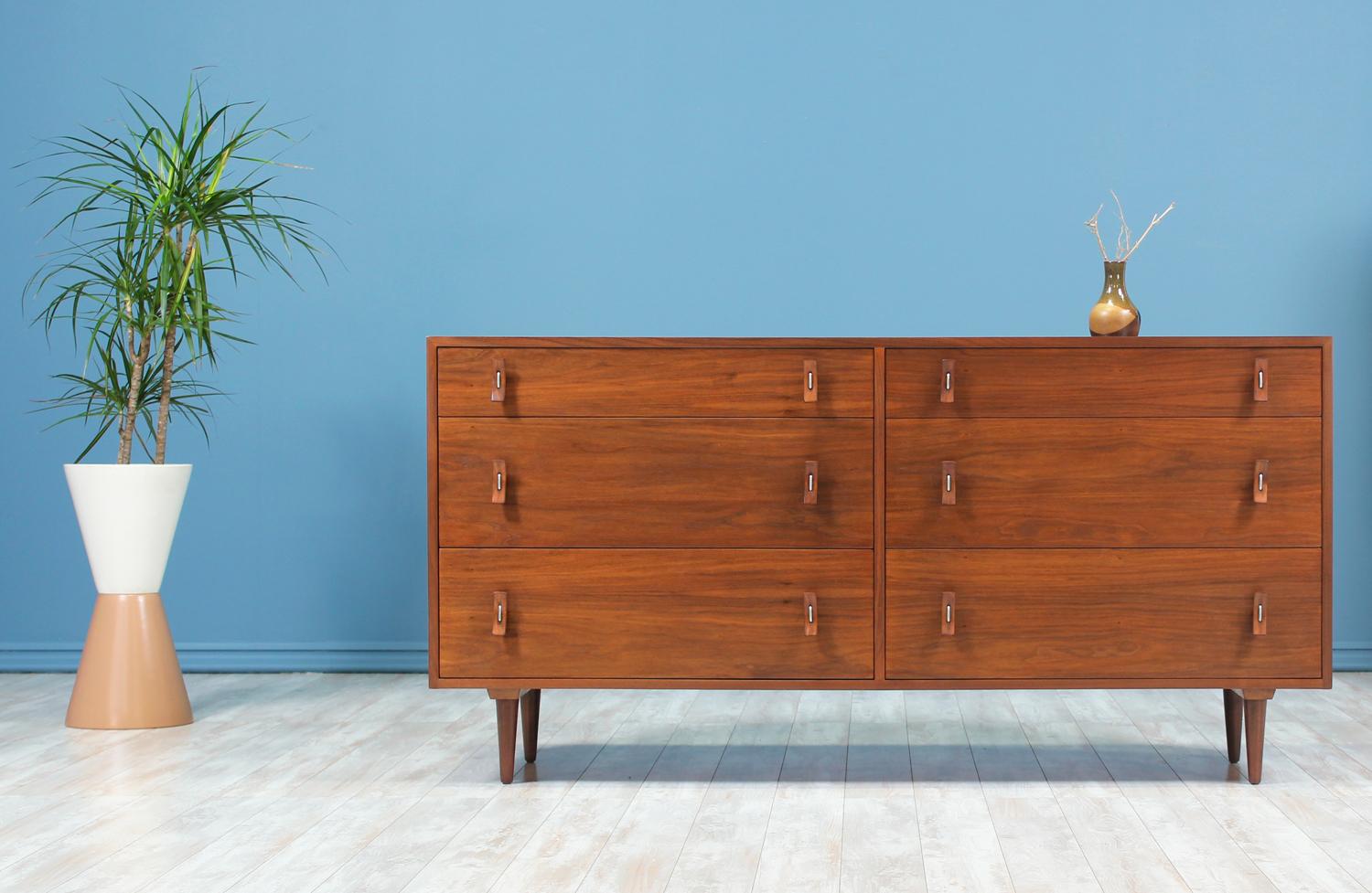 Designer: Stanley Young
Manufacturer: Glenn of California
Country of origin: United States
Date of manufacture: 1950-1959
Materials: Walnut wood, steel hardware
Period style: Mid-Century Modern

Condition: Excellent
Extra conditions: Newly