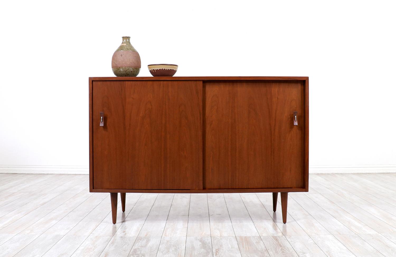 Stanley young walnut credenza with Lacquered drawers for Glenn of California.