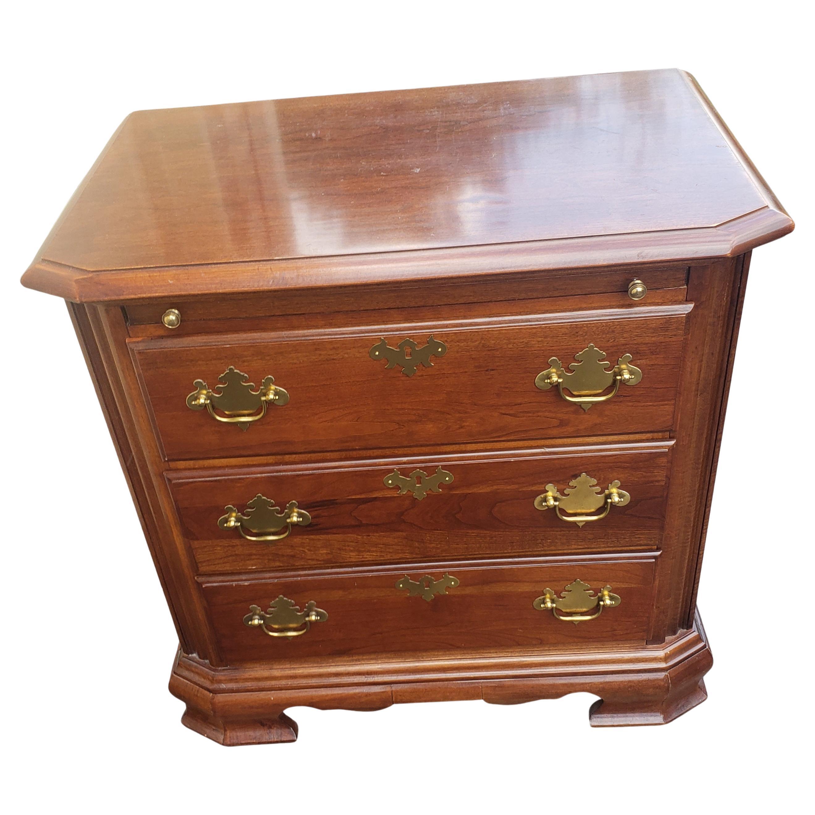 Beautifully crafted Chippendale bedside tables from American Craftman Collection by Stanley Furniture. Solid cherry with brass handles. Pull out tray, smooth dovetailed drawers. Very good condition. Minor wear, appropriate with age and