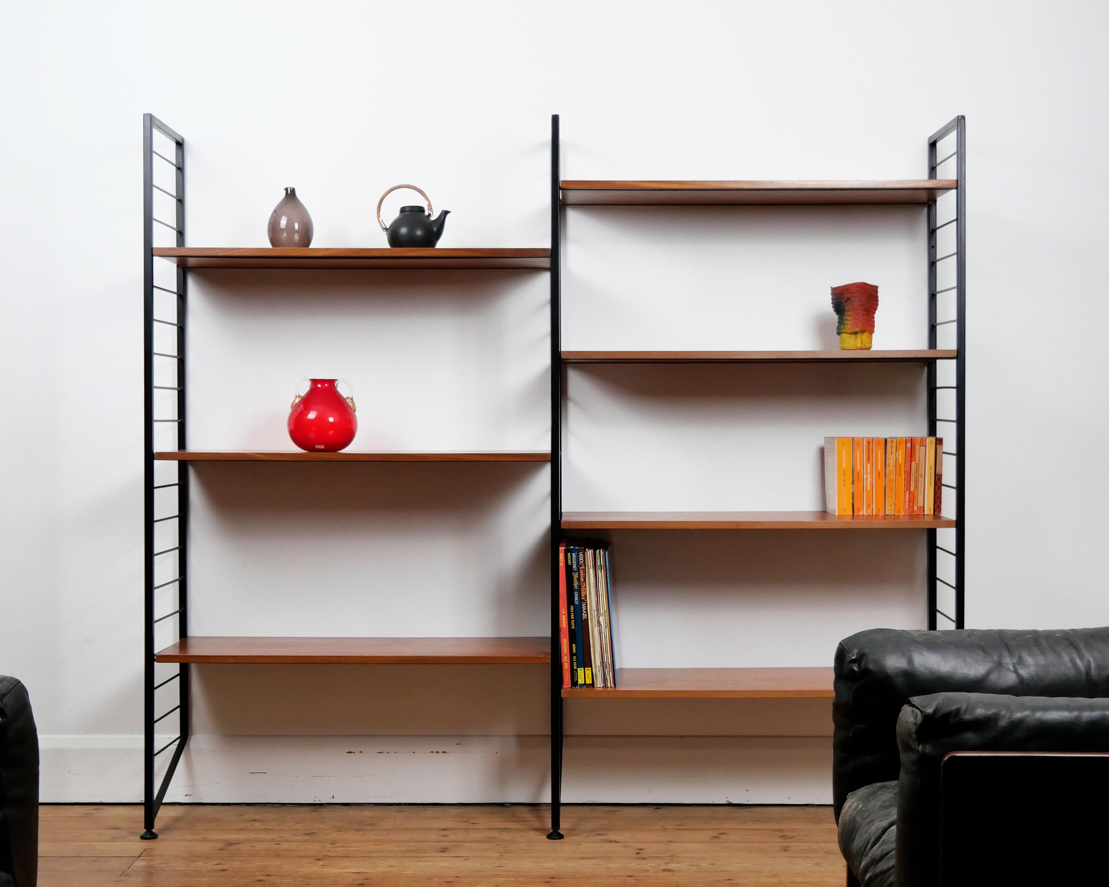 Robert Heal for Staples, 1964
'Ladderax' shelving system

Two bay system. Seven wooden shelves (each with recessed metal supports), three metal 'ladder'  uprights.

Unit: W 184.5 cm, D 35.5 cm, H 162.5 cm
Individual shelf boards: W 89.5 cm, D 35.5