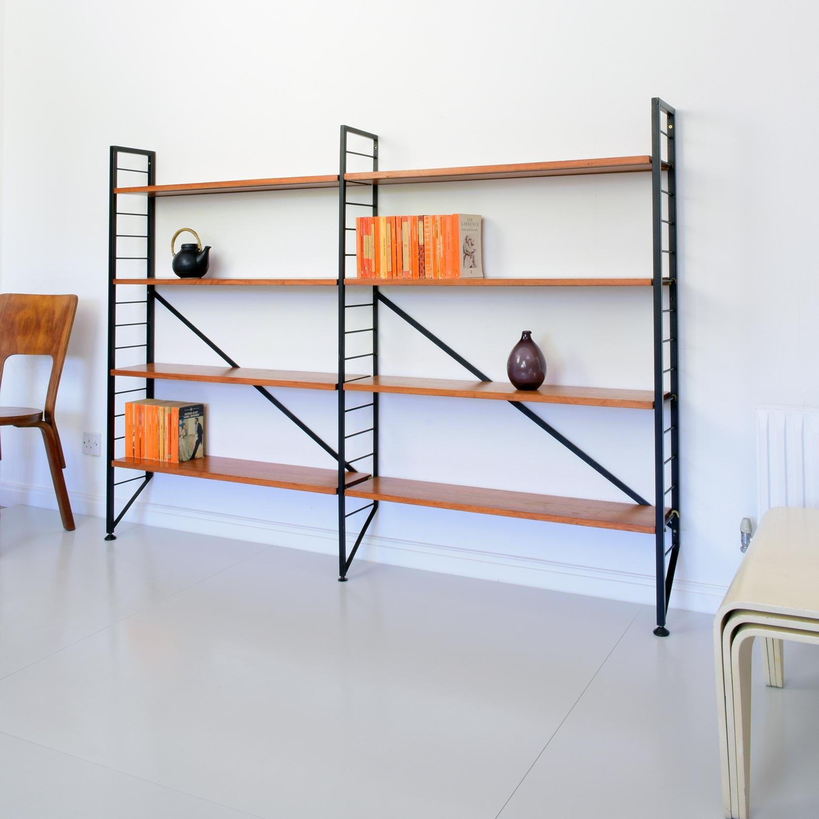 Robert Heal for Staples, 1964
'Ladderax' shelving system

Two bay system with eight wooden shelves (each with two recessed metal supports), three metal uprights (two end uprights and one central upright) and two metal diagonal-braces. The shelves