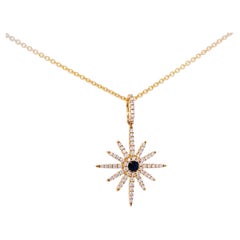 Pendentif étoile lumineuse avec pendentif étoile centrale en diamant et saphir