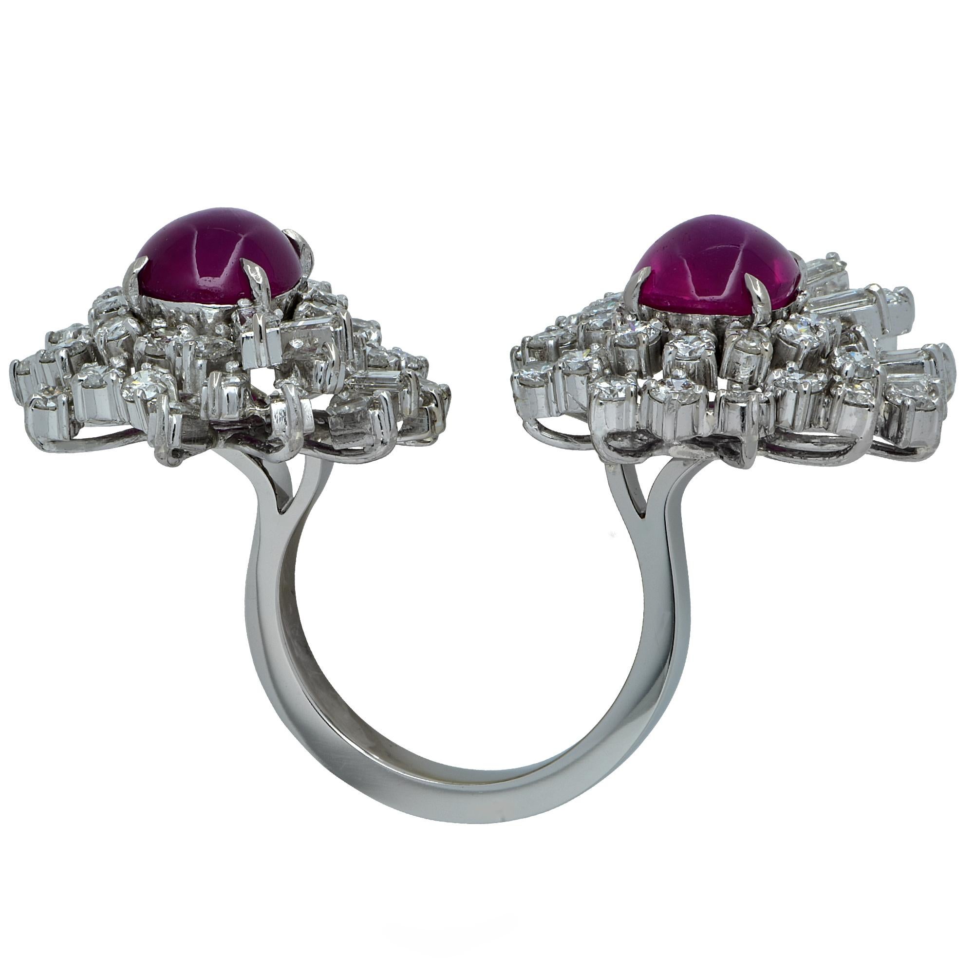 Platinum bypass ring containing a spectacular pair of extremely fine unheated burma rubies weighing approximately 8cts total, surrounded by approximately 5cts of mixed cut diamonds. Accompanied by an AGL Report

Our pieces are all accompanied by an