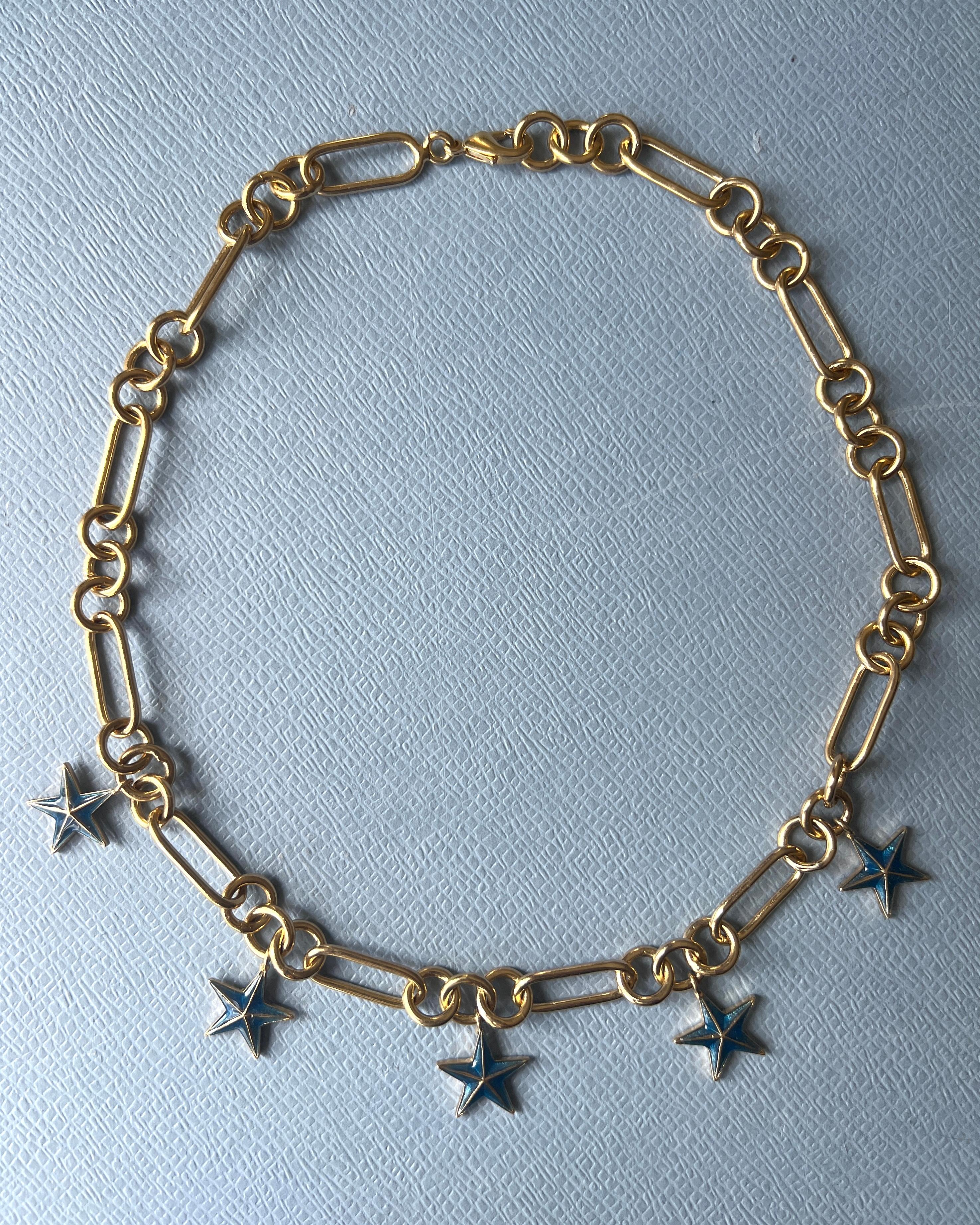 Star Charm Chain Necklace Gold Plated Choker  with Blue 5 hand painted Enamelled Star Pendant on a 14k Gold Plated

The five-pointed star, often known as the pentagram, holds significant spiritual symbolism across various traditions and beliefs. It
