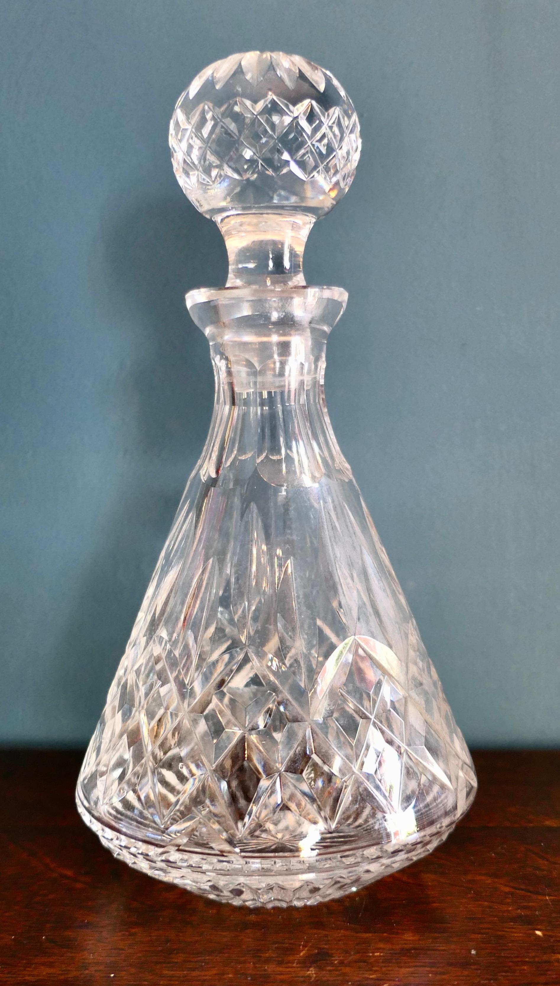 Star cut glass decanter.
A Classic of its time this lovely piece is in good condition, it has a delightful well balanced shape dating from the middle of the 20th Century. The Decanter has beautiful Star cut into the base and the original