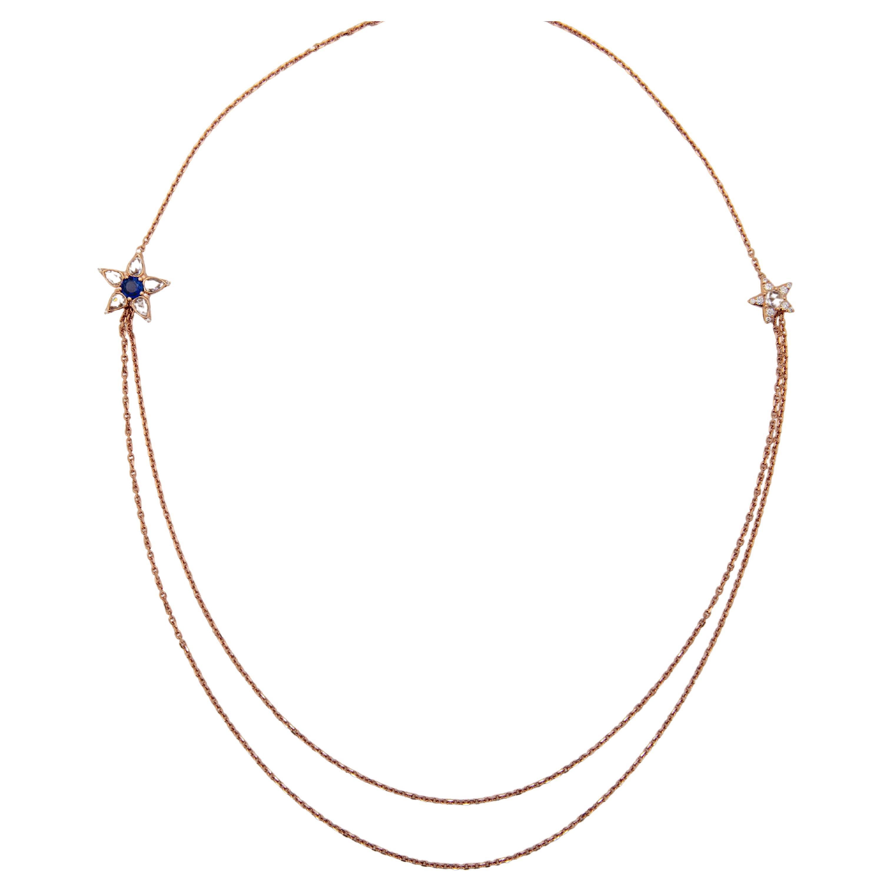 Beautiful 18K Rose Gold Necklace with two stars and double chain from under the stars. 

Ceylon Sapphire 0.37ct. 
Rose Cut Diamonds 0.78ct total. 
Round Brilliant Diamonds 0.15ct total.

3 length settings. Shortest setting 56cm, longest setting