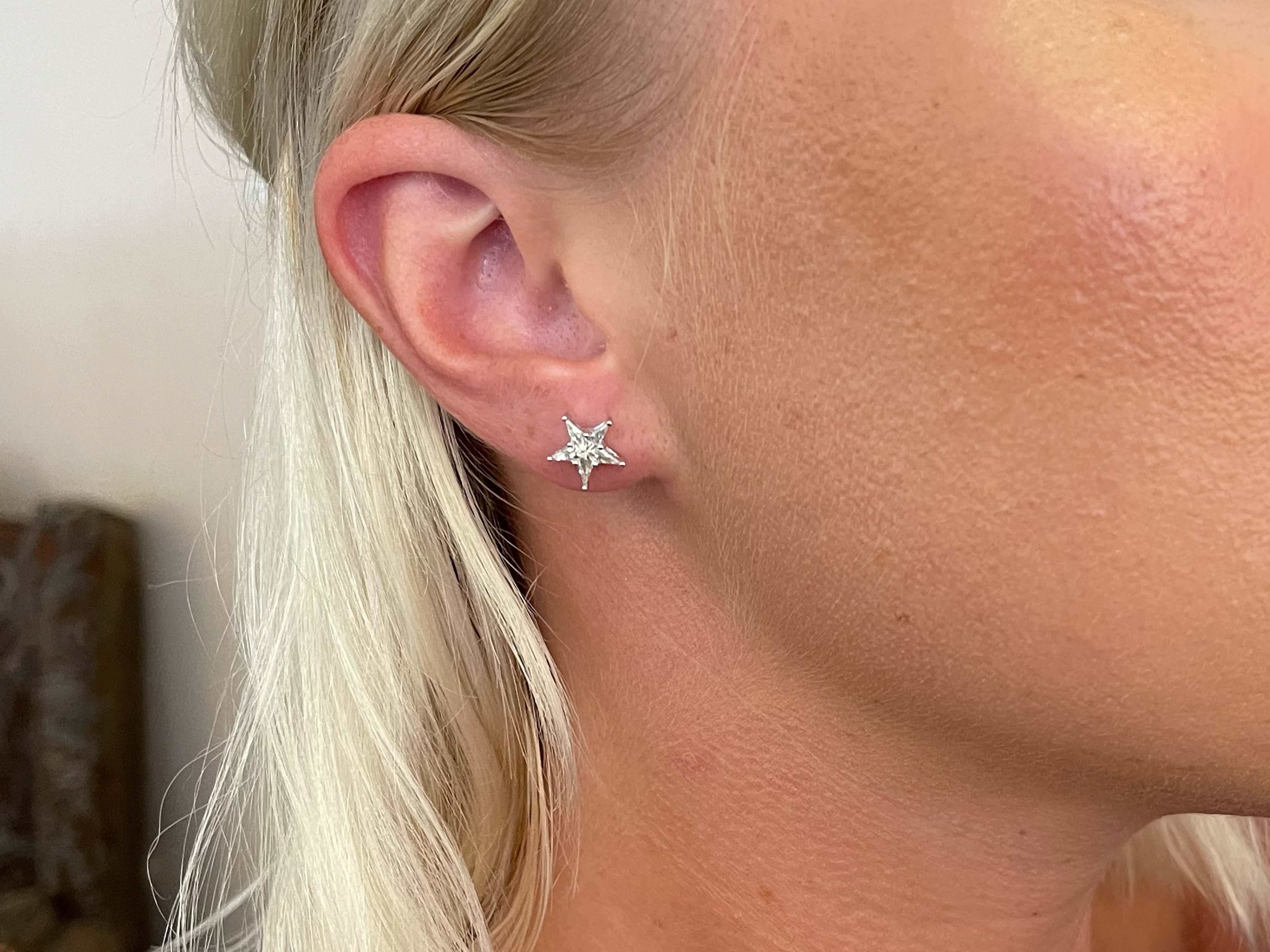 These gorgeous earrings each feature a star cut diamond prong set, with a total carat weight of 0.57 carats. The diamonds are G-H, VS and have beautiful sparkle. The earrings measure 10 mm in diameter. These earrings are beautifully crafted in white