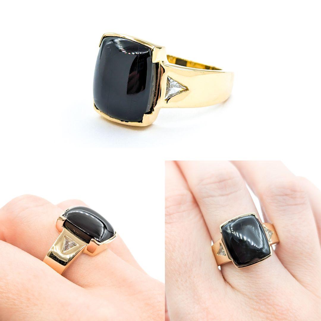 Star Diopside Ring With Diamonds In Yellow Gold

Introducing this exquisite gemstone ring crafted in 14kt yellow gold. Featuring a 13.63ct Star Diopside centerpiece and .31ctw Triangle Diamonds of I clarity and near colorless white hue, this ring is