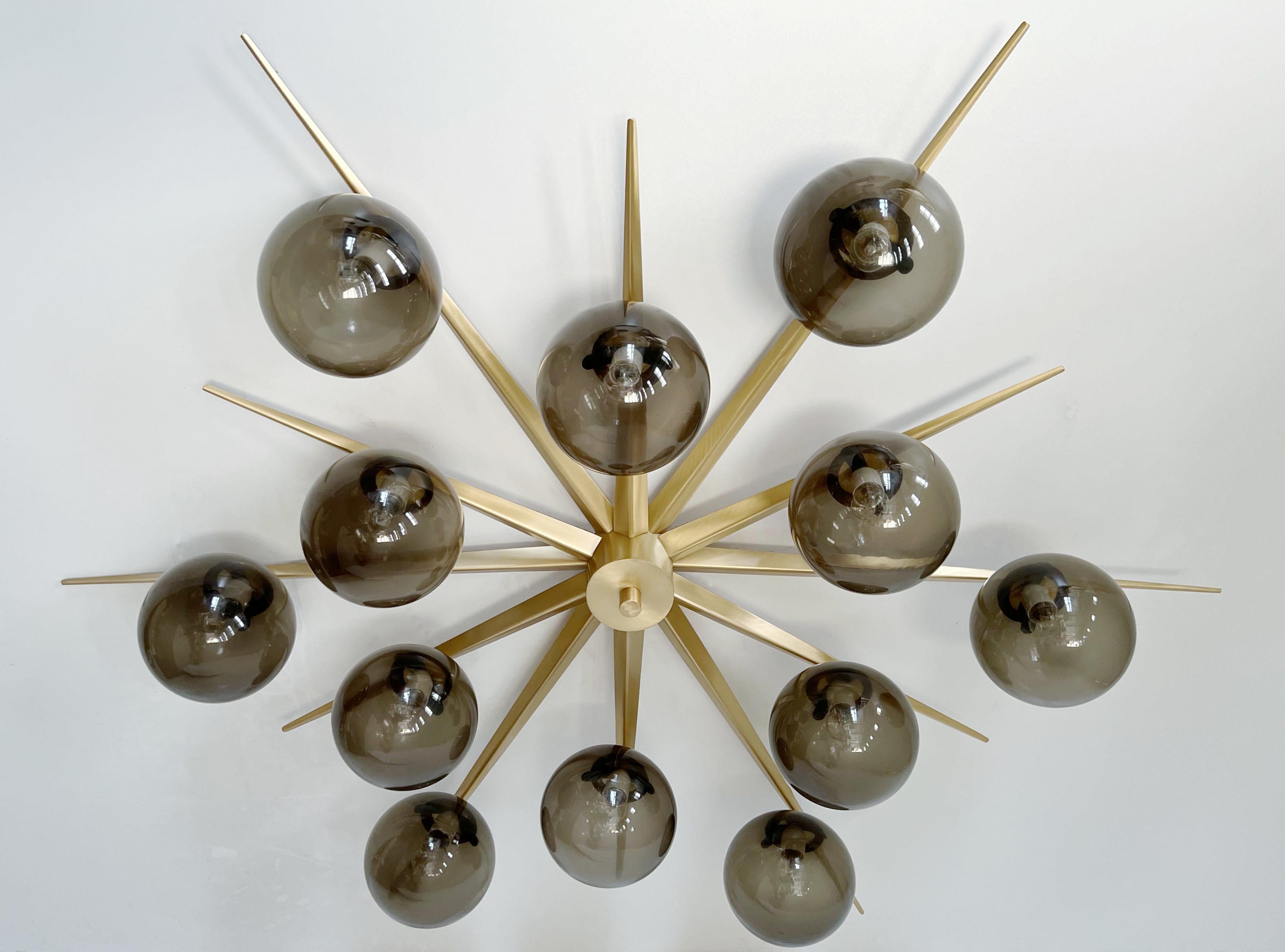 Italian flush mount with 12 large Murano glass globes mounted on brass frame / Made in Italy
Designed by Fabio Ltd, inspired by Angelo Lelli and Arredoluce styles
12 lights / E12 or E14 type / max 40W each
Diameter: 64 inches / Height: 14