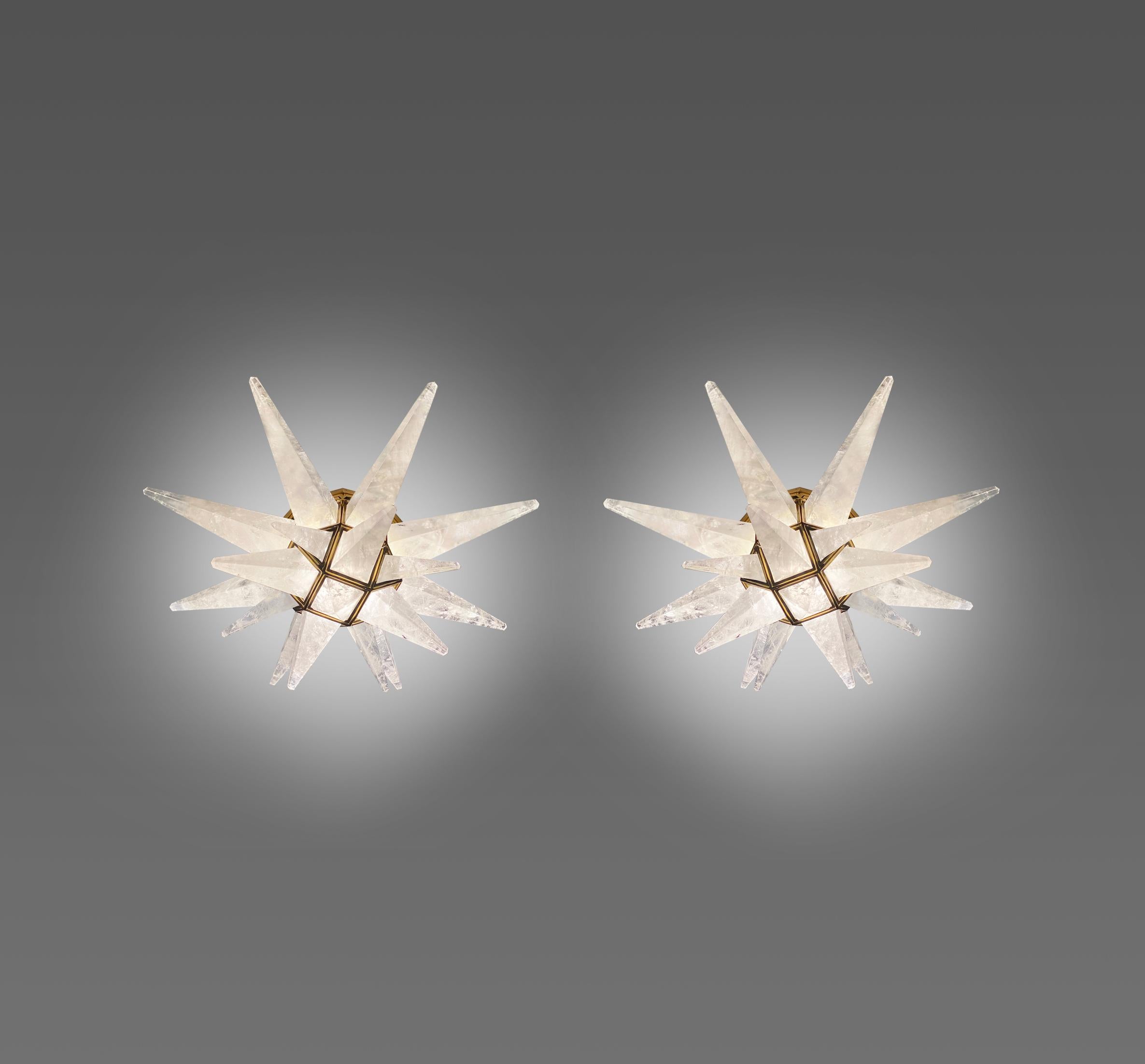 Pair of star form rock crystal flushmounts with polish brass frames. Created by Phoenix Gallery, NYC.
  