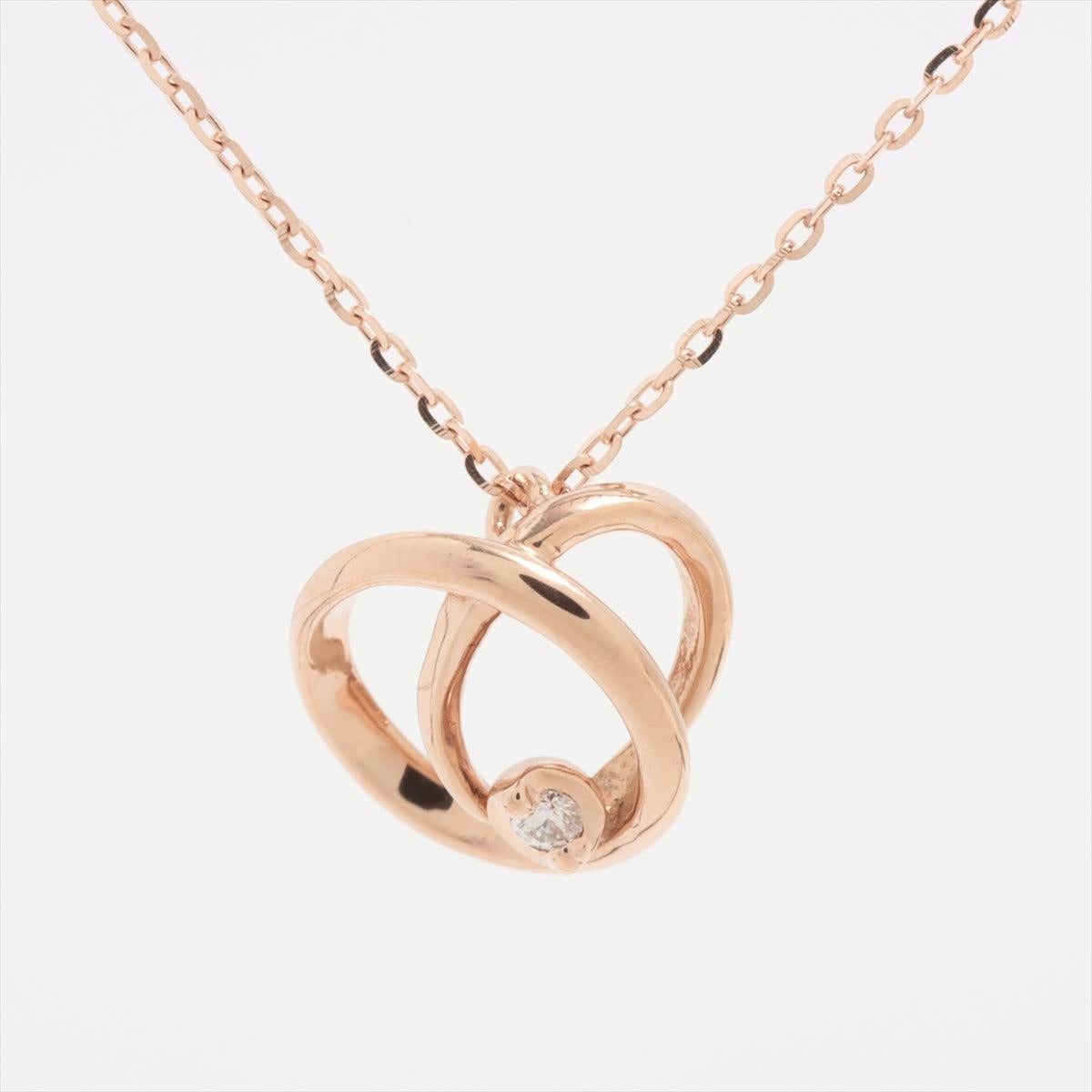 The Star Jewelry Diamond Necklace in gold is a romantic and elegant piece that adds a touch of sparkle to any look. The necklace features a unique open-heart like design, formed by two intersecting circles, symbolizing love and unity. At the